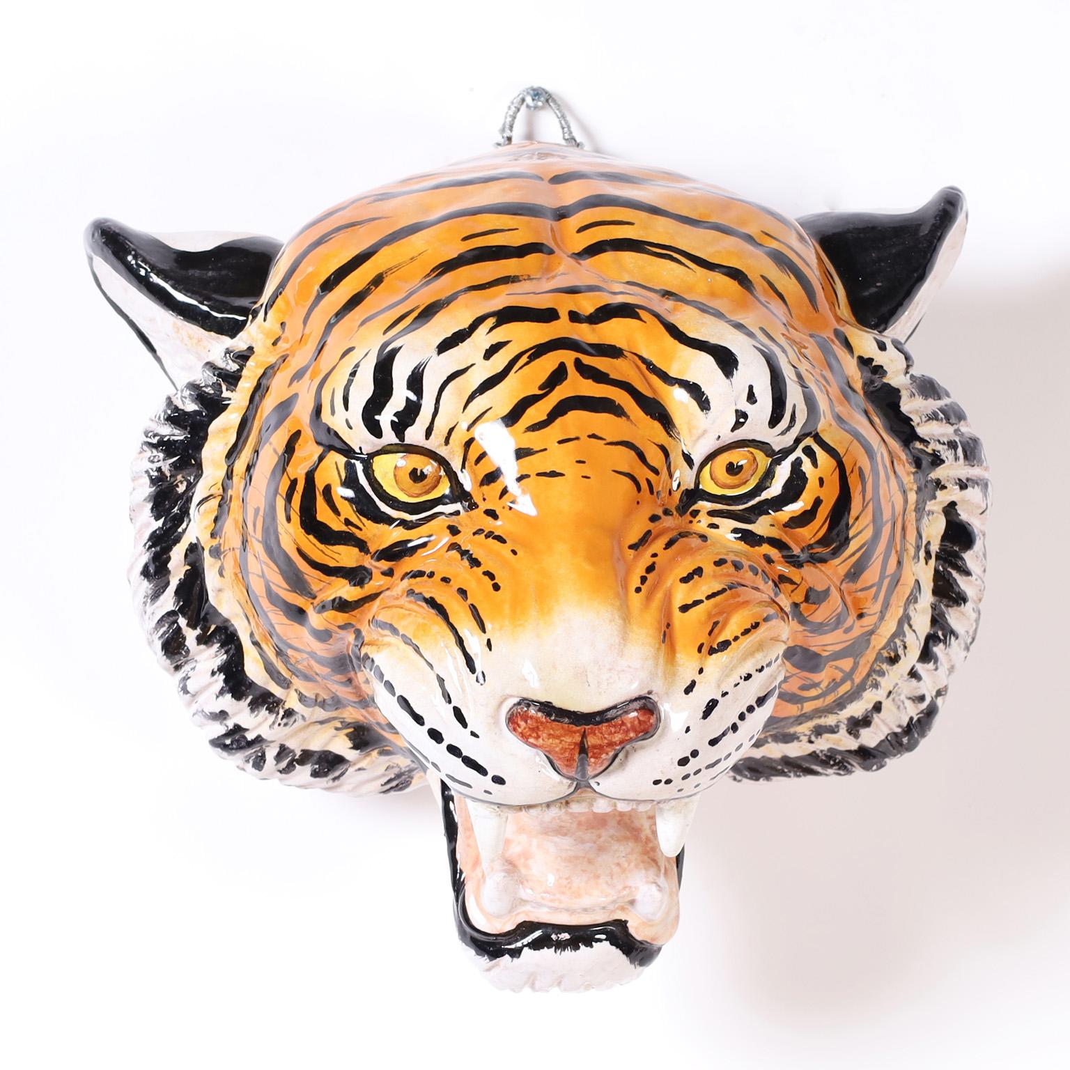 One of mother nature's most iconic designs, the big cat. Here we present two terra cotta wall mounted heads decorated and glazed, a tiger and a leopard depicted with amazing accuracy. Priced individually at $3,200 each.