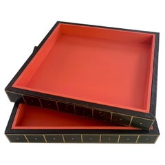 Two Gold Embossed Leather and Wood Trays in Orange and Black