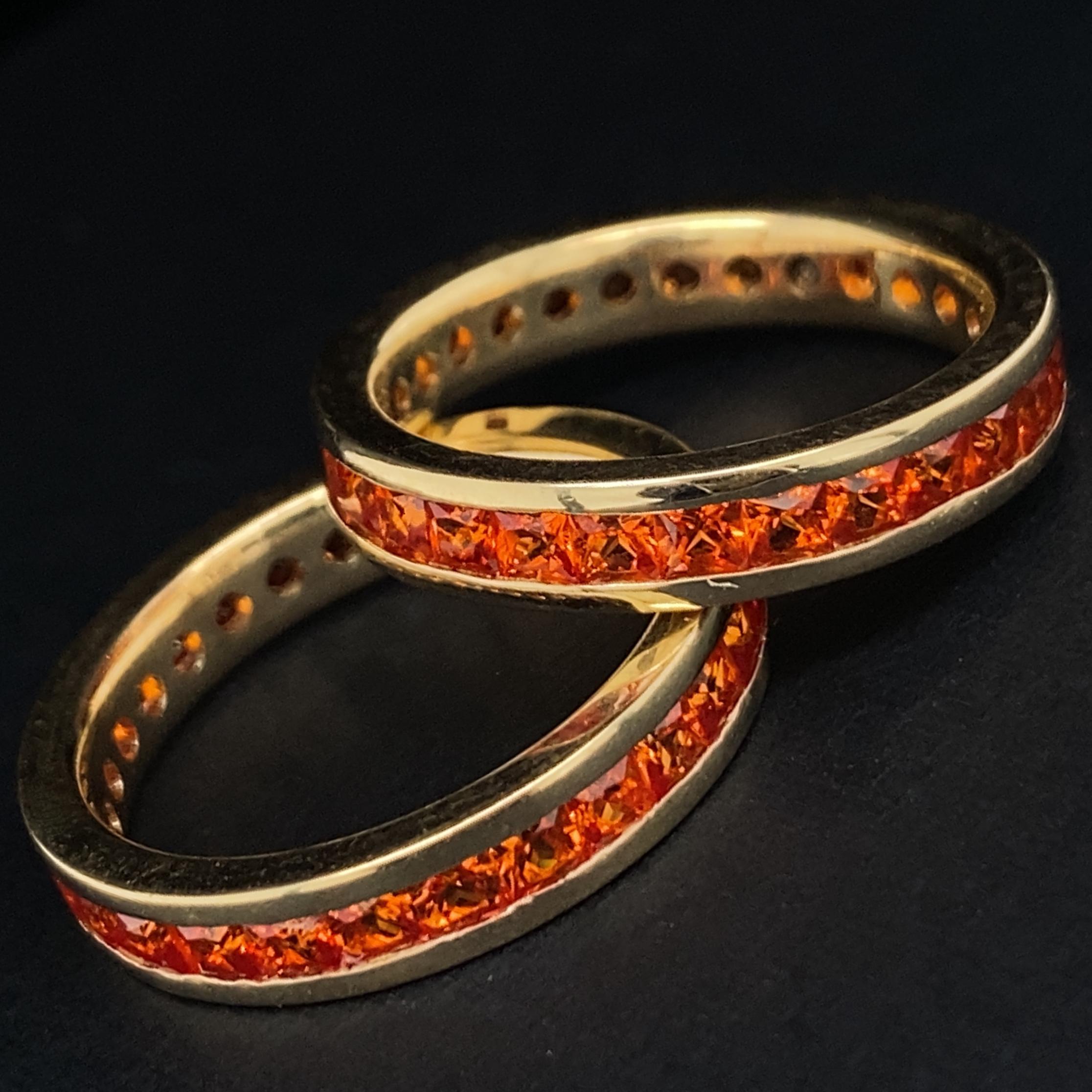 Two Gold Eternity Stacker Bands with Channel-Set Square Cut Orange Sapphires For Sale 1