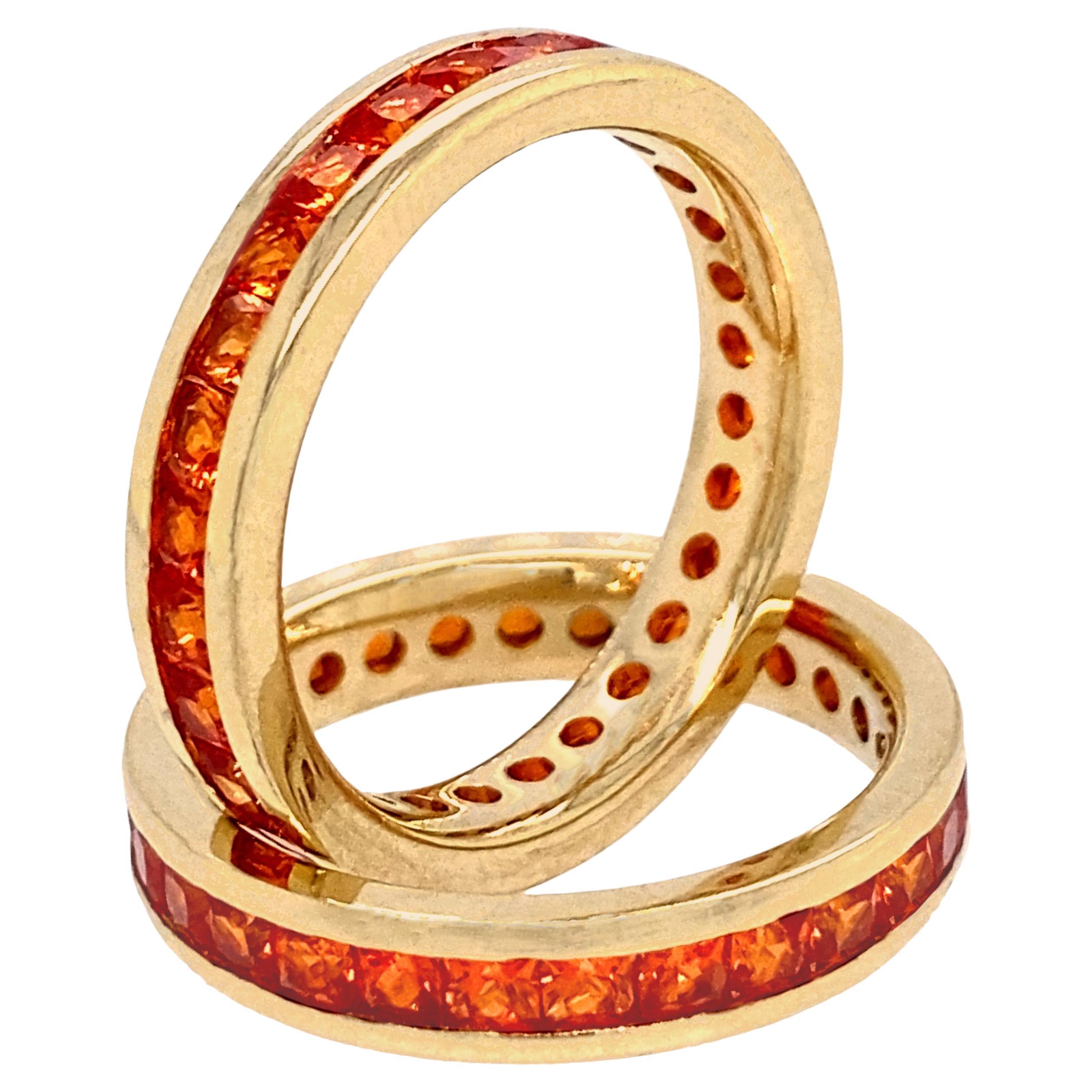 Two Gold Eternity Stacker Bands with Channel-Set Square Cut Orange Sapphires For Sale