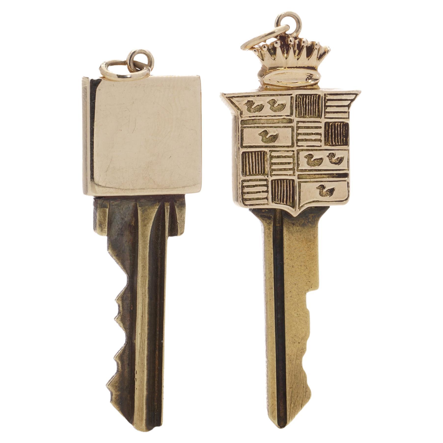 Two gold mounted keys, one with Cadillac logo design finial, Tiffany & Co. 14kt. For Sale
