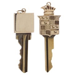 Vintage Two gold mounted keys, one with Cadillac logo design finial, Tiffany & Co. 14kt.