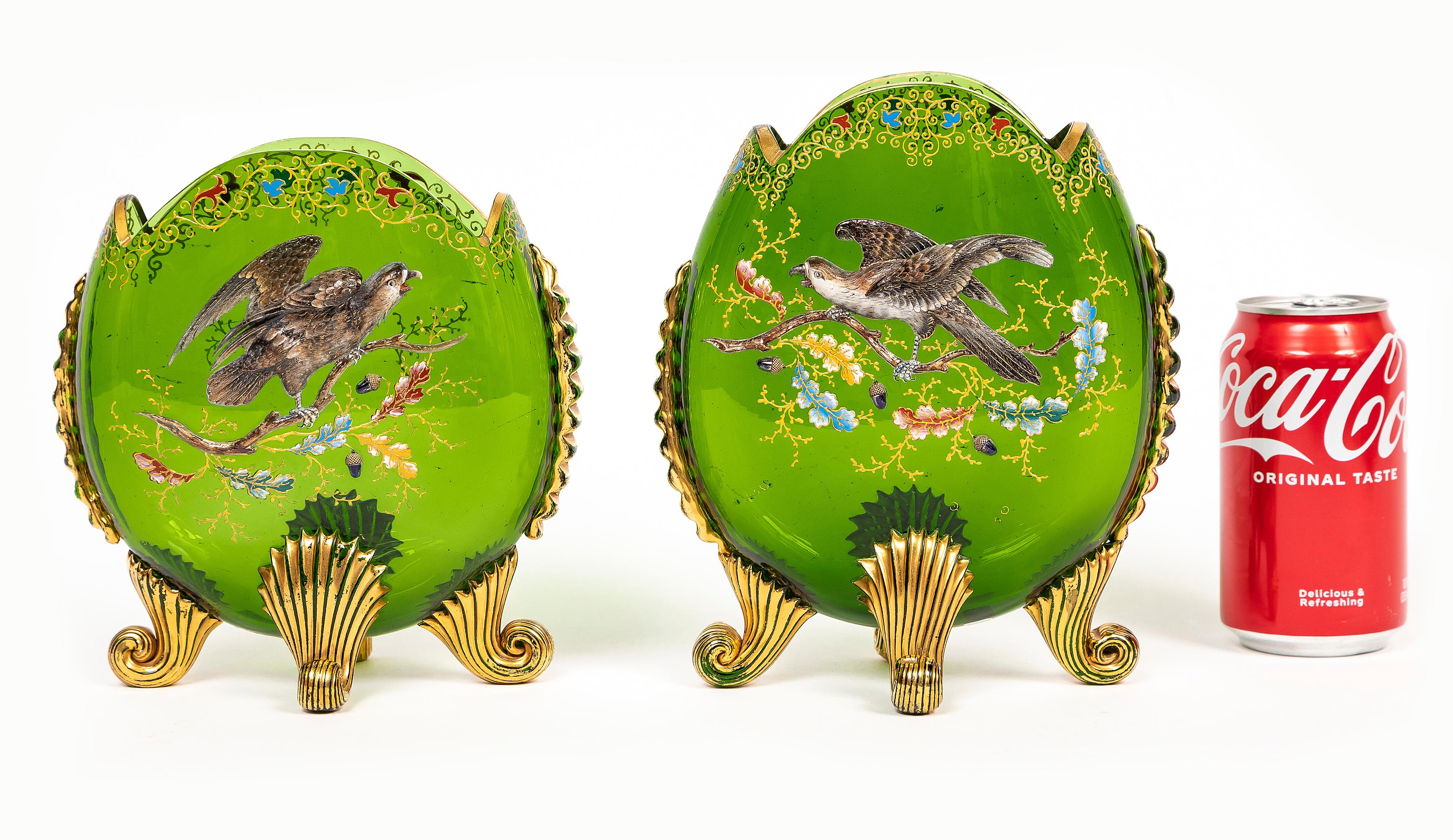 Two Fantastic Late 19th Century Green Moser Crystal Pillow Vases with Applied Raised Enamel Falcon's, Acorns, and Oak Leaves, Adorned with 24K Gilding.  Each vase is of flattened ovoid form with a gorgeous green crystal color.  An incredible Falcon