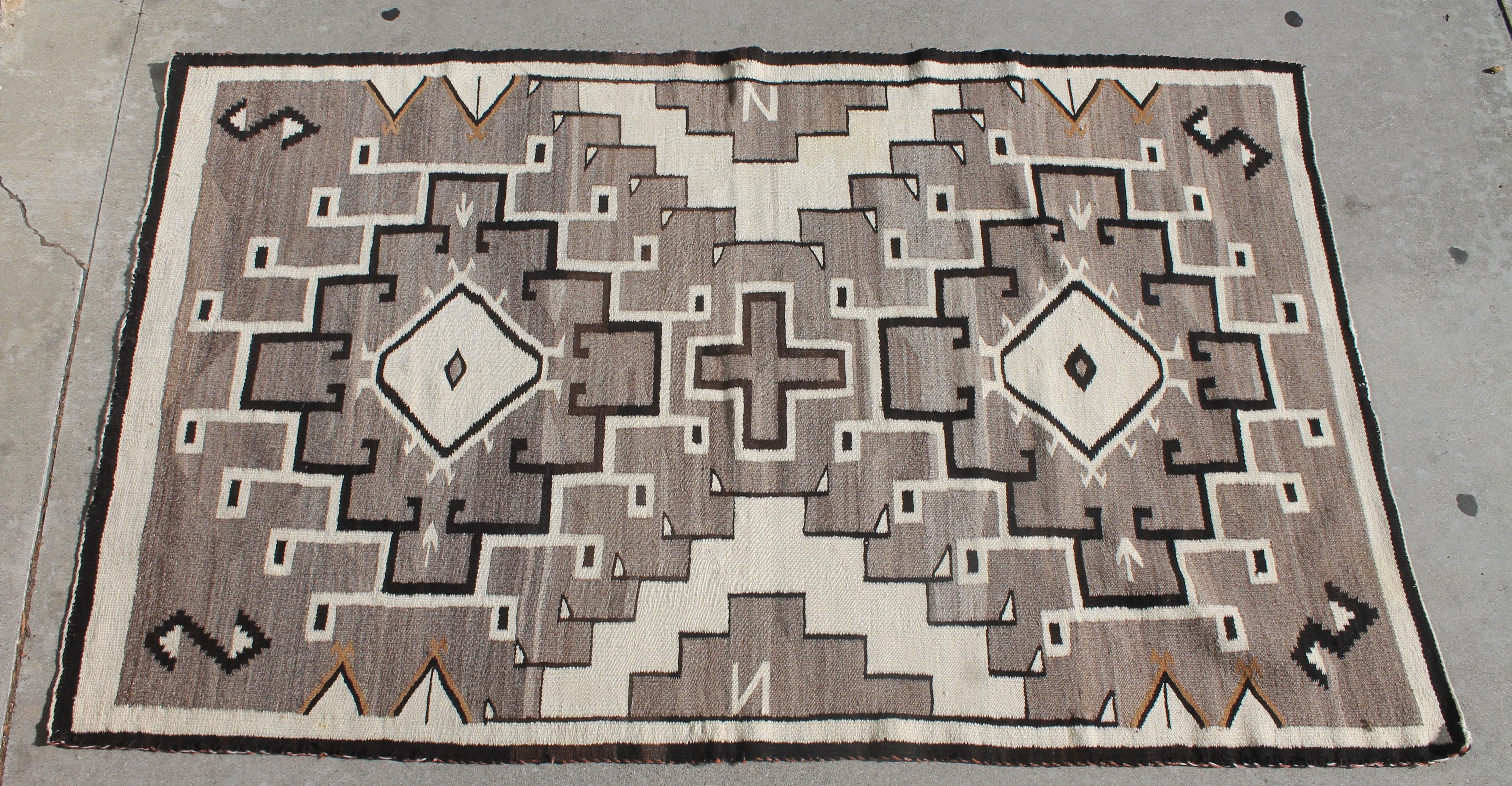This fine American Indian weaving is a great example of a great geometric Navajo rug. The condition is very good.