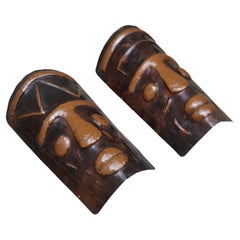 Two Hammered Copper Sconces in the Shape of African Masks