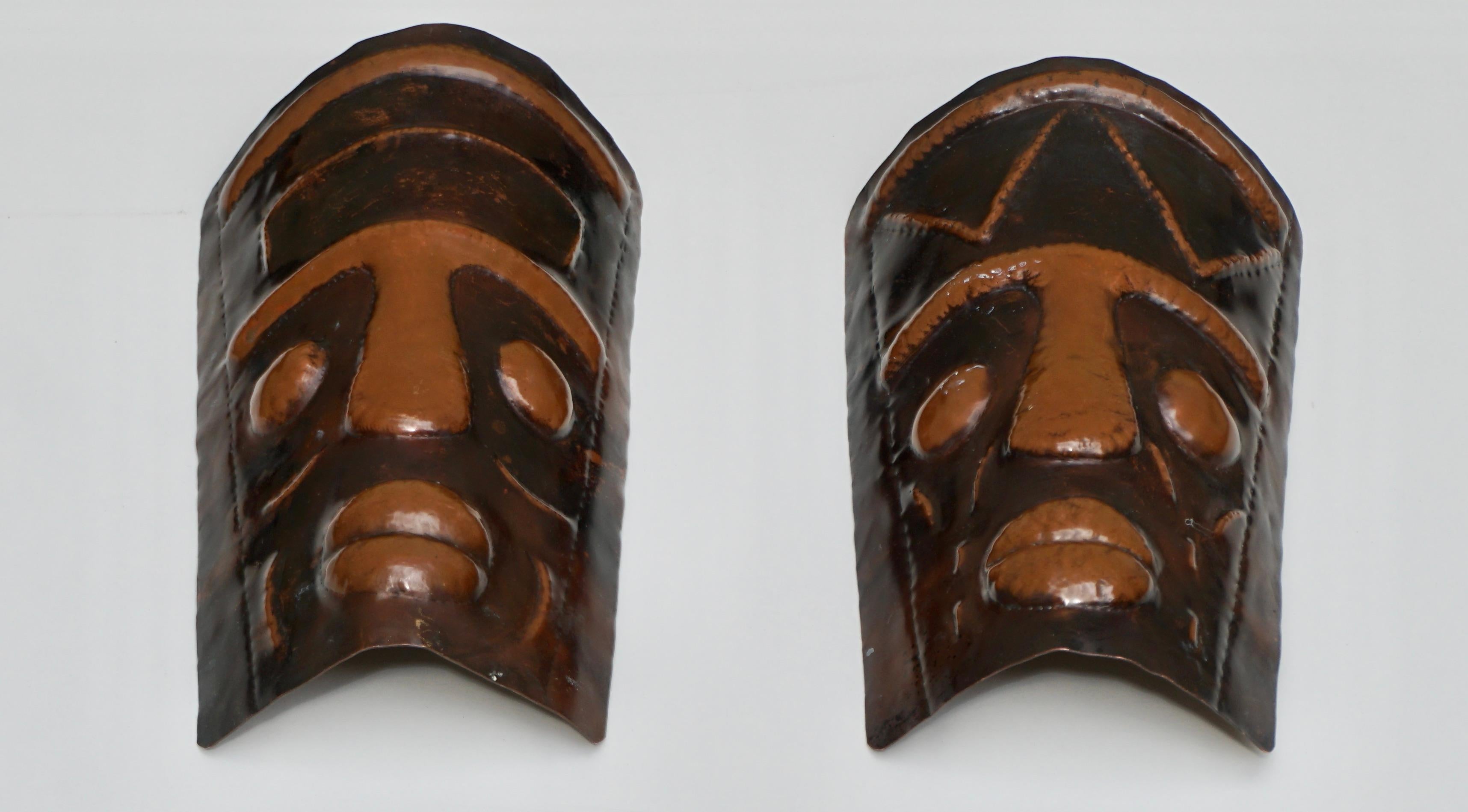 Belgian Two Hammered Copper Sconces in the Shape of African Masks For Sale