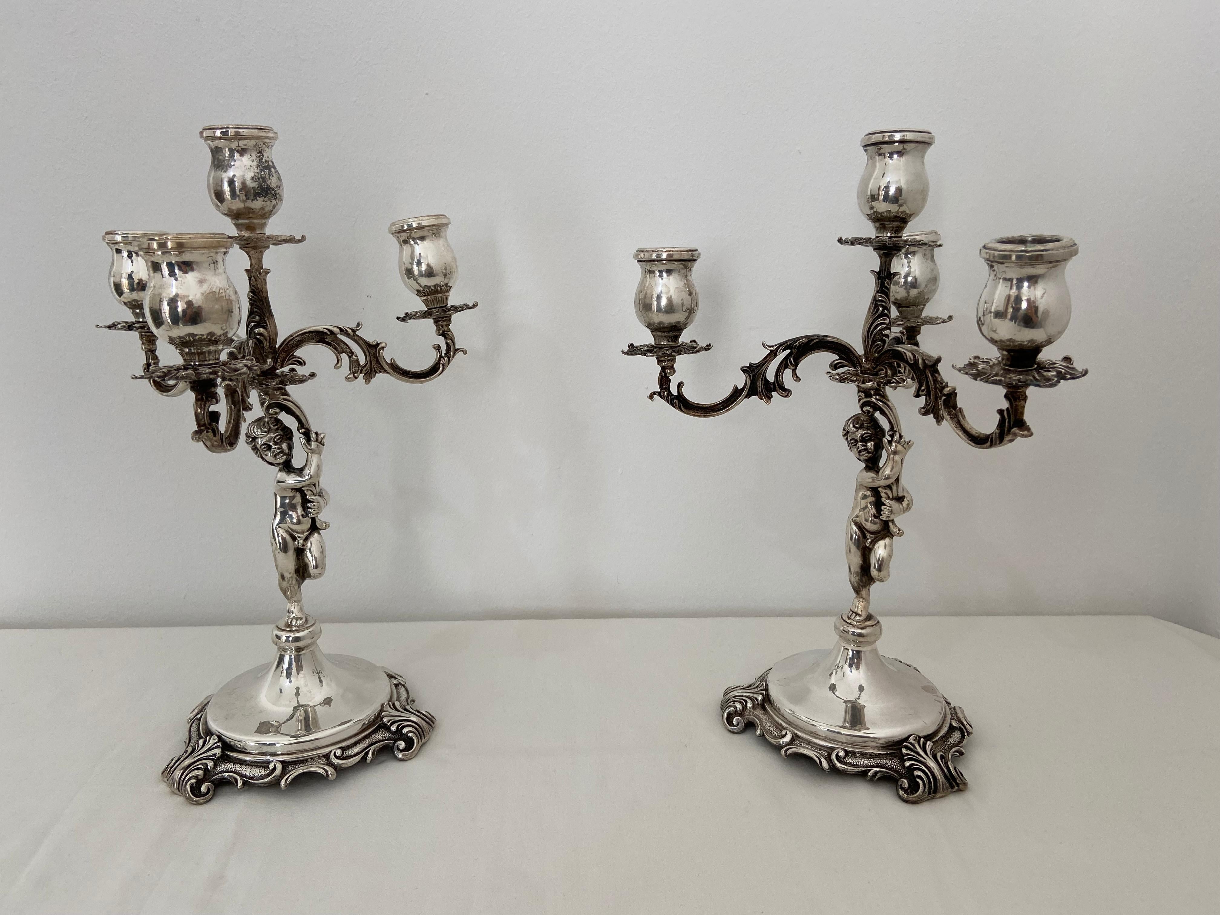 Two handcrafted candelabra in 800 silver. Works of art.
These are not the usual boxed candlesticks. These are two pieces of the Italian high school silversmith. Unique, massive pieces. Entirely handcrafted. Dedicated to connoisseurs. Each weighs