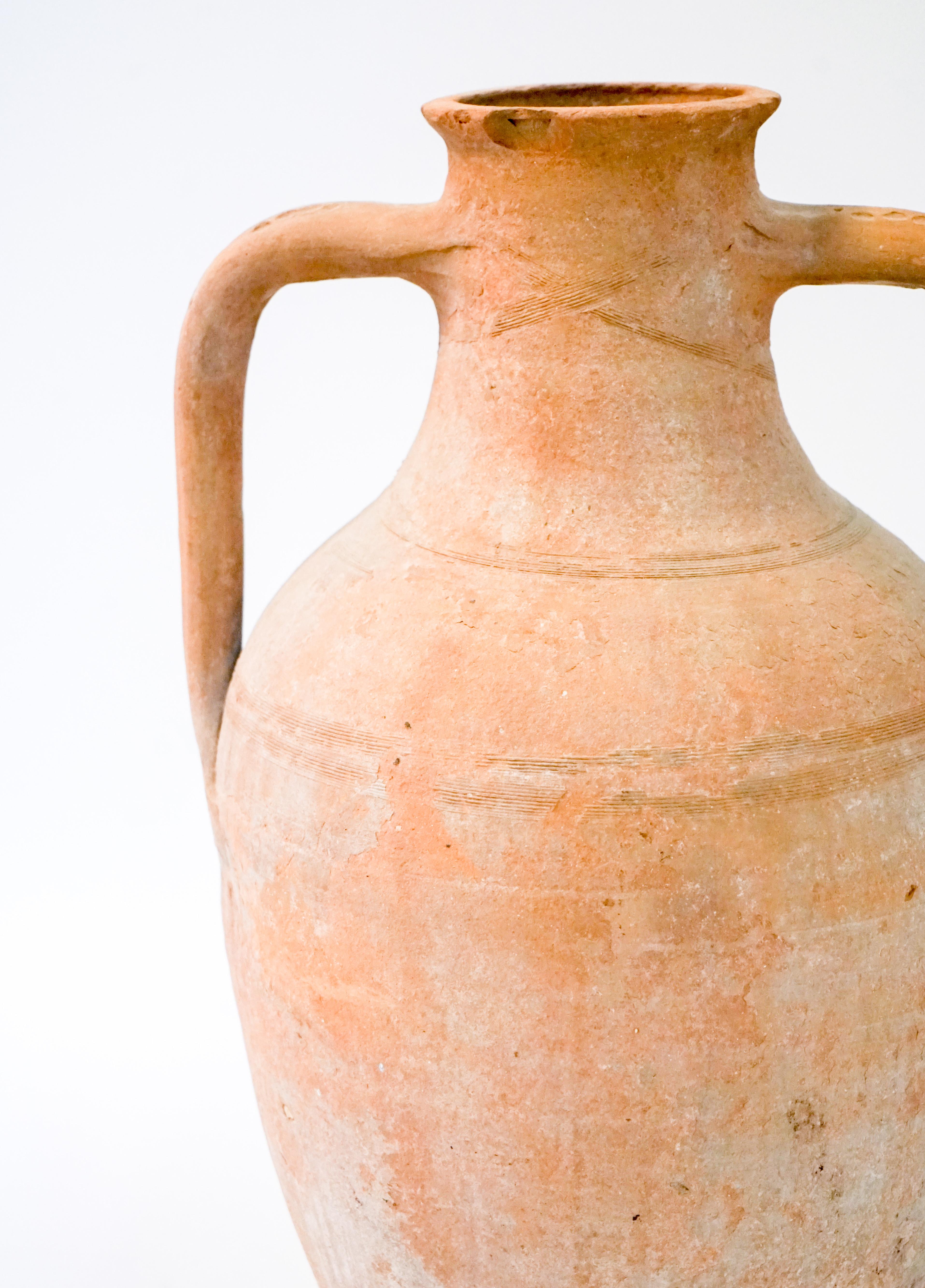 Terracotta Greek vessel with two handles.

Origin: Greece

Measurements:
Approx. 20