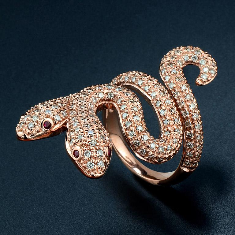 Special Design of animal ring for this year. Two-Head Snake Ring was made in 18K Rose Gold that fit lengthwise with the finger. 
Eyes are set with Ruby 4 pcs. 0.09 ct. and surrounding with Diamonds (I-J color I clarity) on the body 196 pcs. 1.46