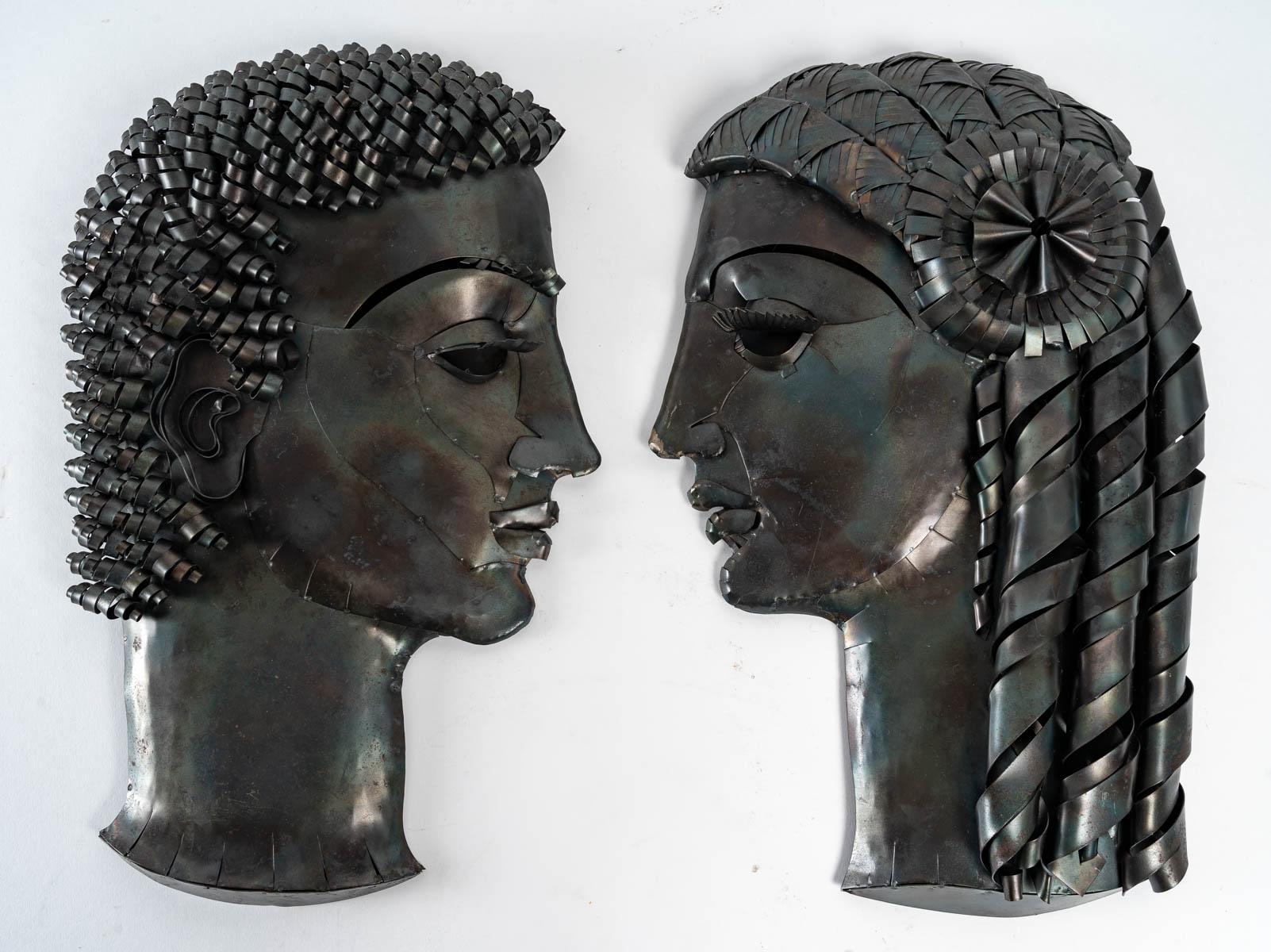 Two patinated sheet metal heads by Léon Masson (1911-1984), circa 1970, Man and Woman, signed and titled on the back.
H: 45 cm, W: 24 cm, D: 15 cm

ref 3171