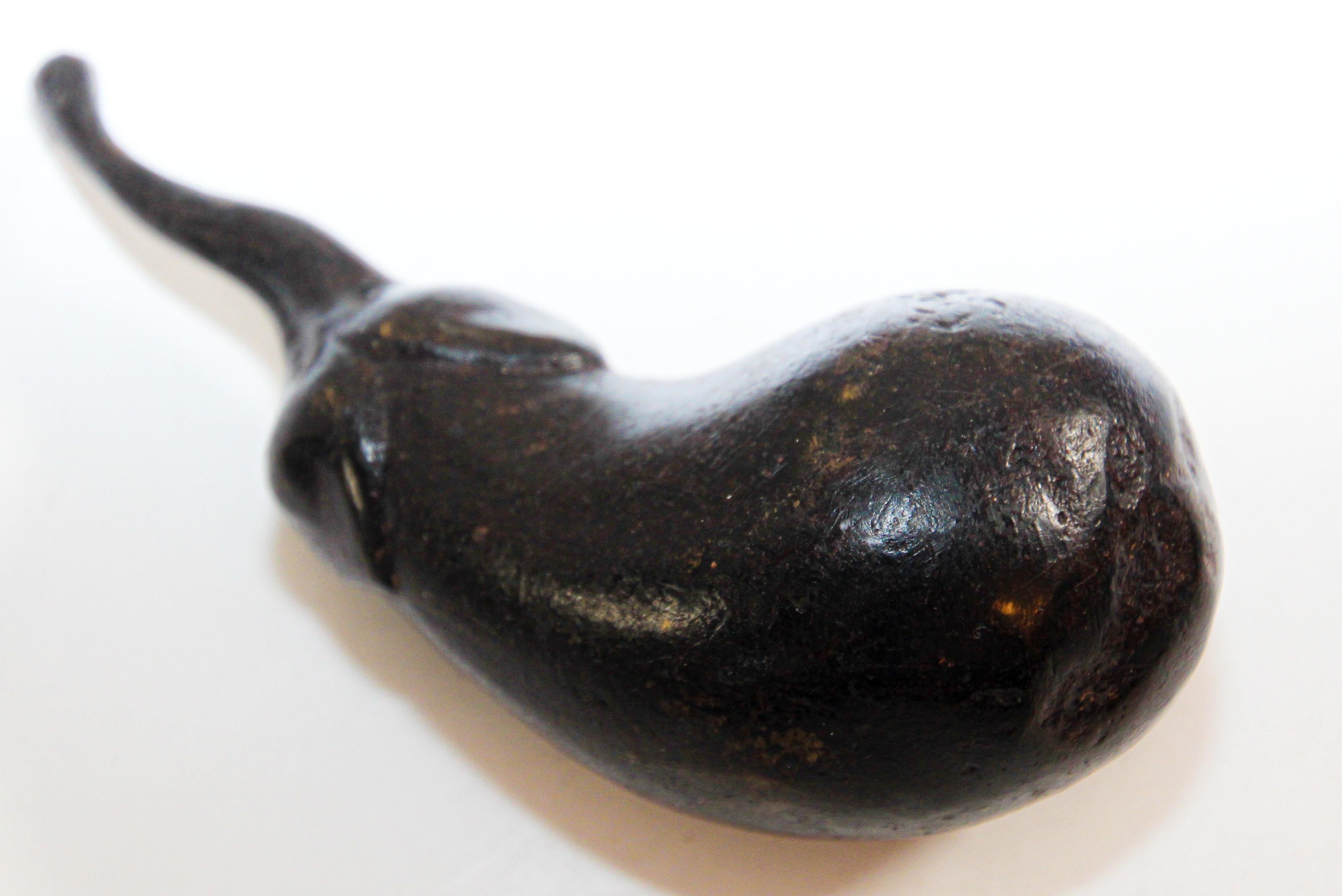 Two heavy solid bronze patinated eggplant 