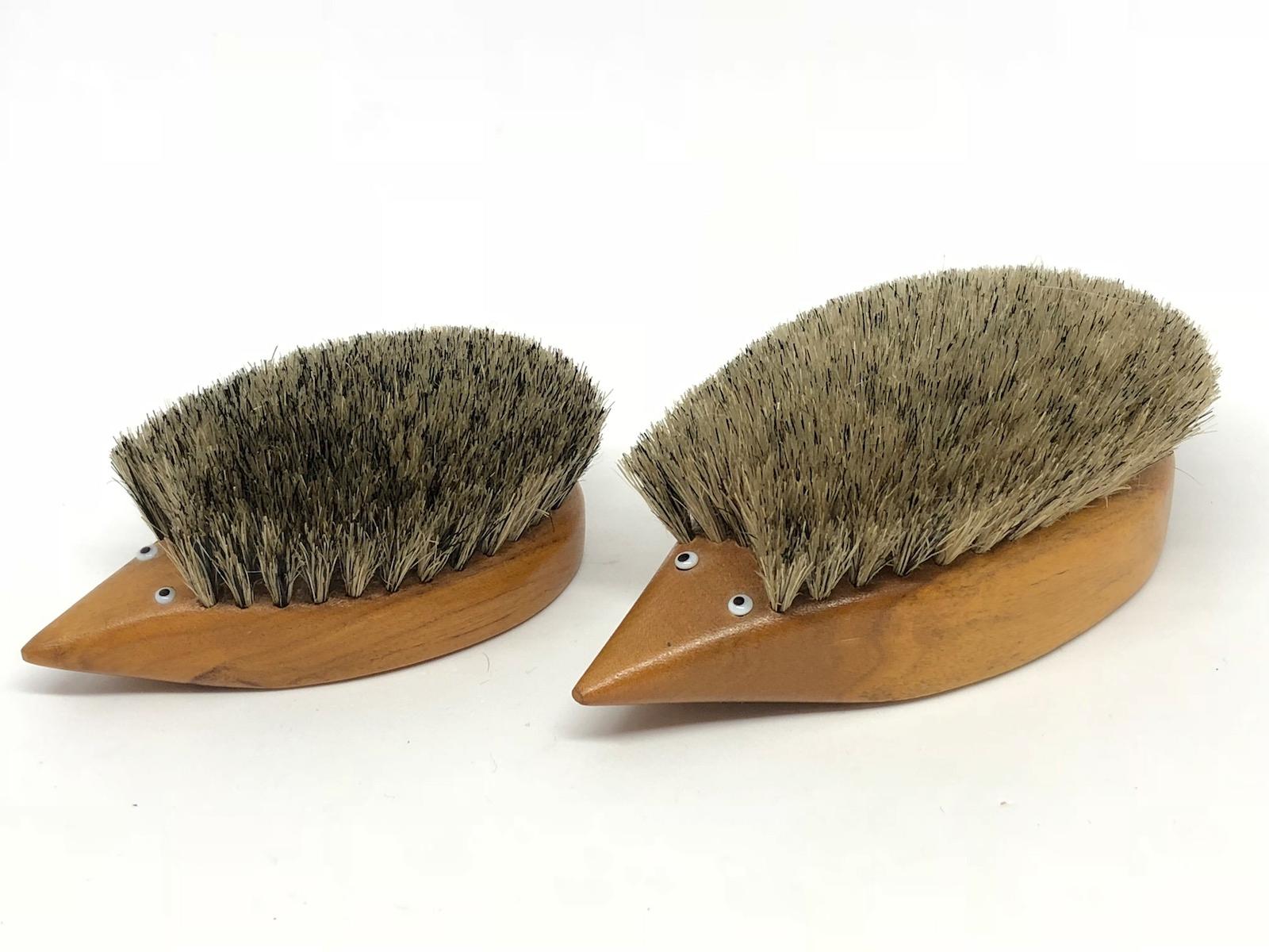 Classic early 1960s Danish design teak wood brush set of two in the form of a hedgehog. Nice addition to your room or just for your collection of Design items. Made of teak wood, hair and wood. They have glass eyes. Found at an estate sale in