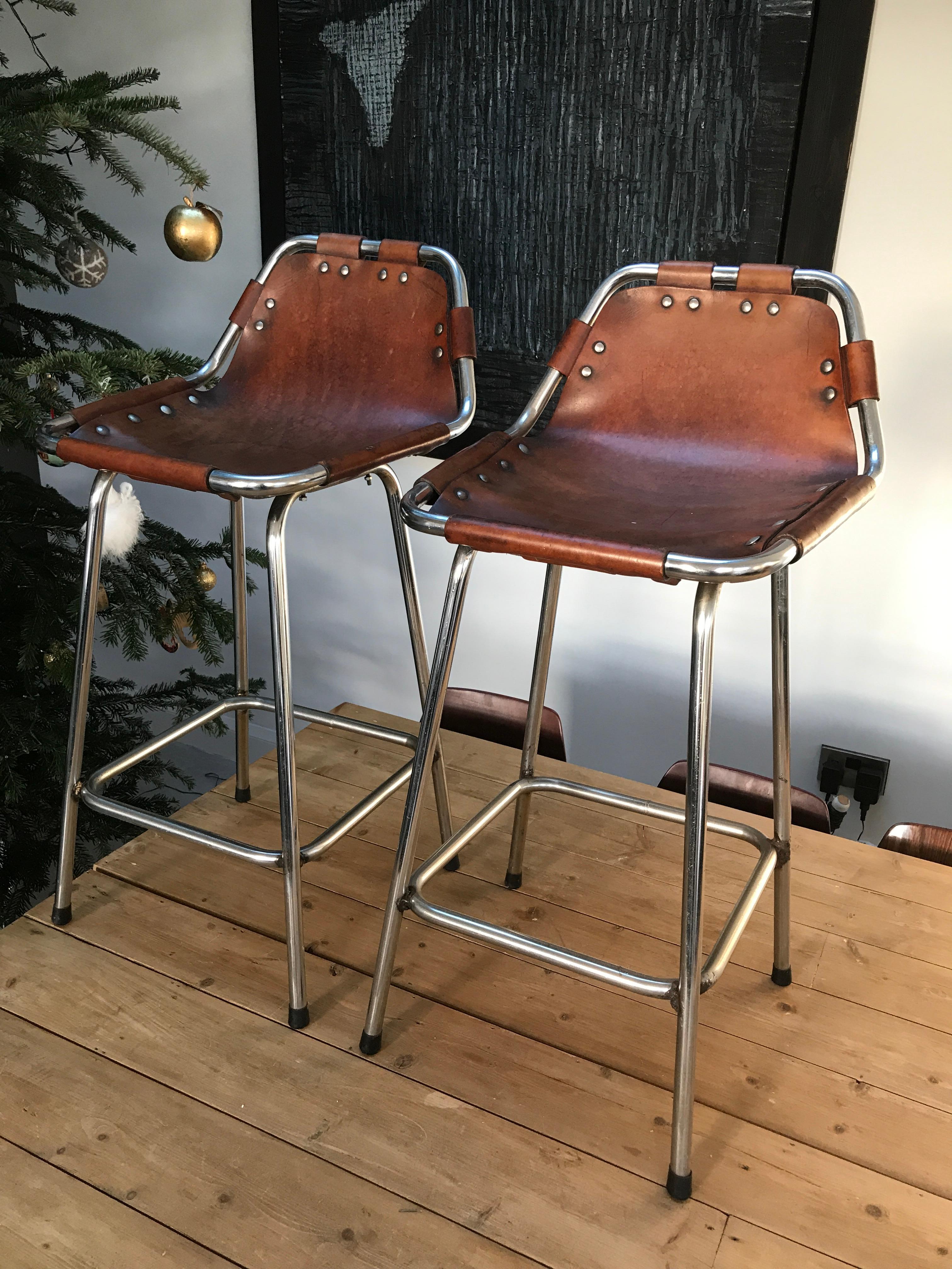 Stunning set of two stools, designer Charlotte Perriand used these in the Ski Resort Les Arcs, circa 1960. These stools were commissioned to be made by Cassina, one of the best Italian furniture maker’s, very nice chrome tubular frame with thick