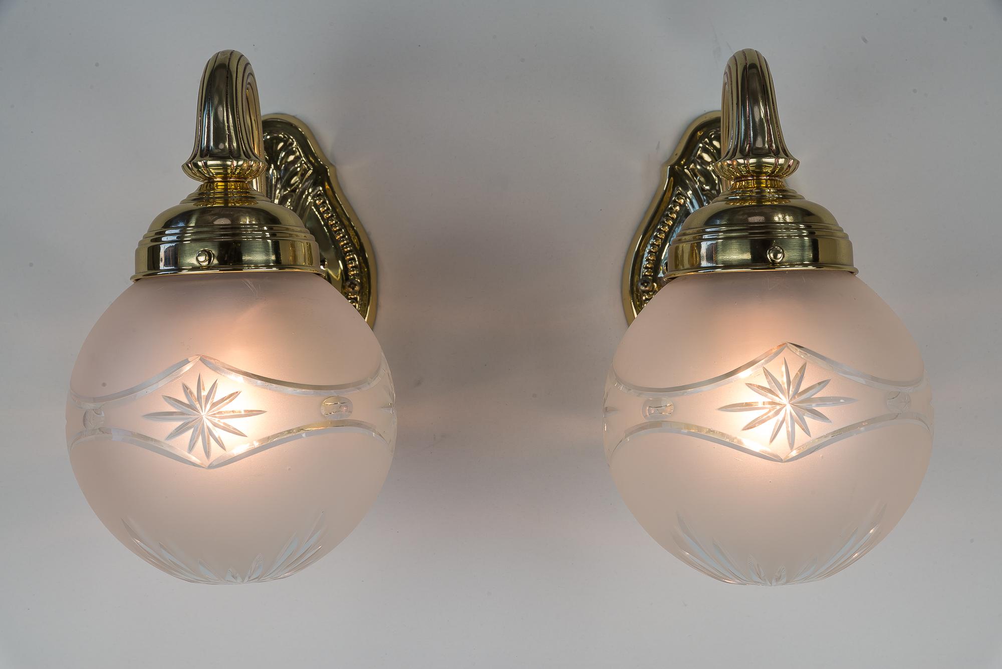 Two Historistic wall lamps around 1890s
Brass polished and stove enameled
Original glass shades.