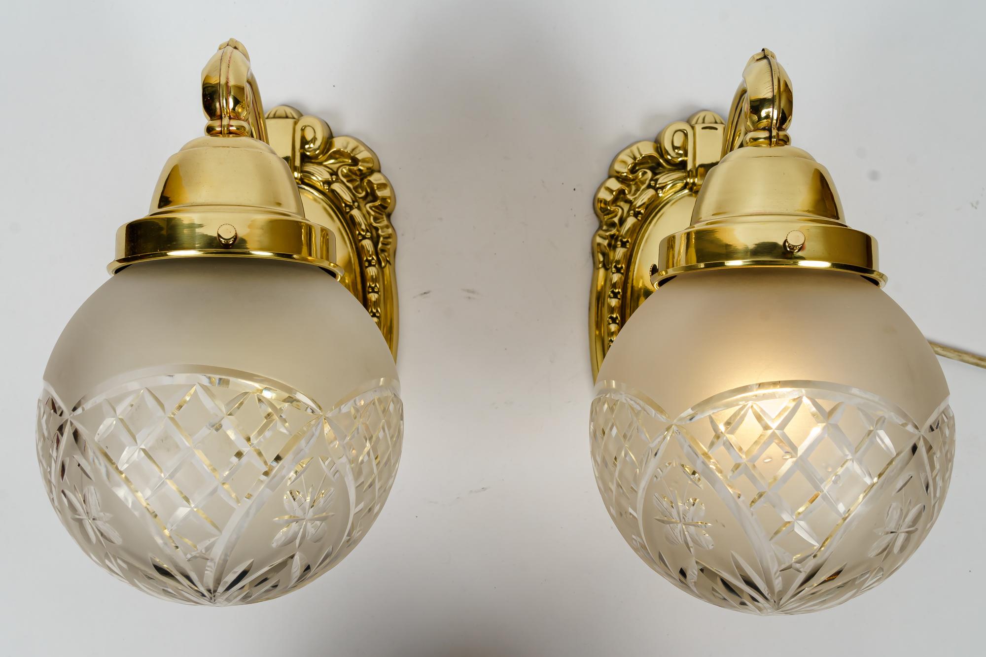 Two historistic wall lamps vienna around 1920s
Polished and stove enameled
Original cut glass shades.