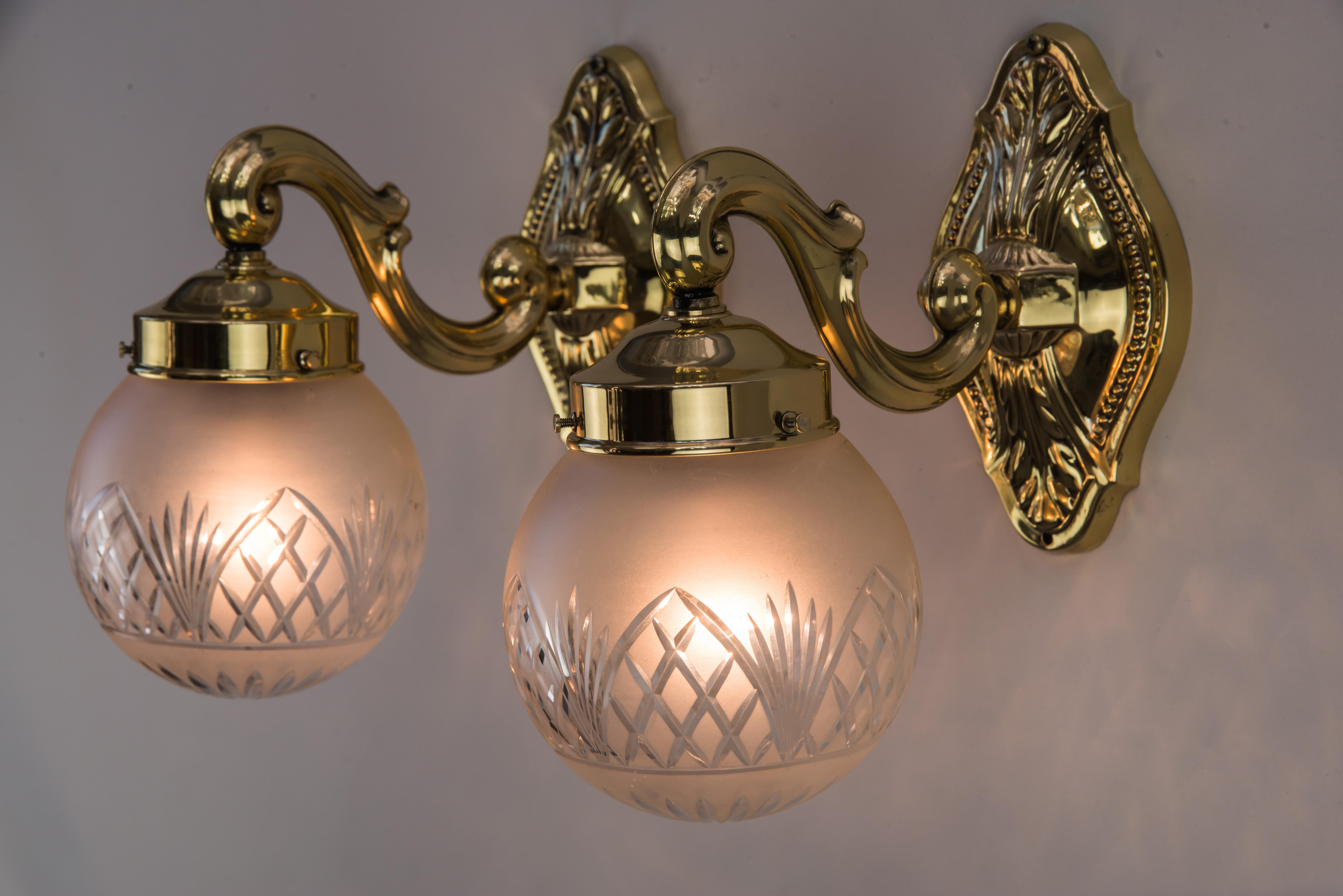 Two Historistic Wall sconces around 1890s with original cut glass shades
Polished and stove enamelled