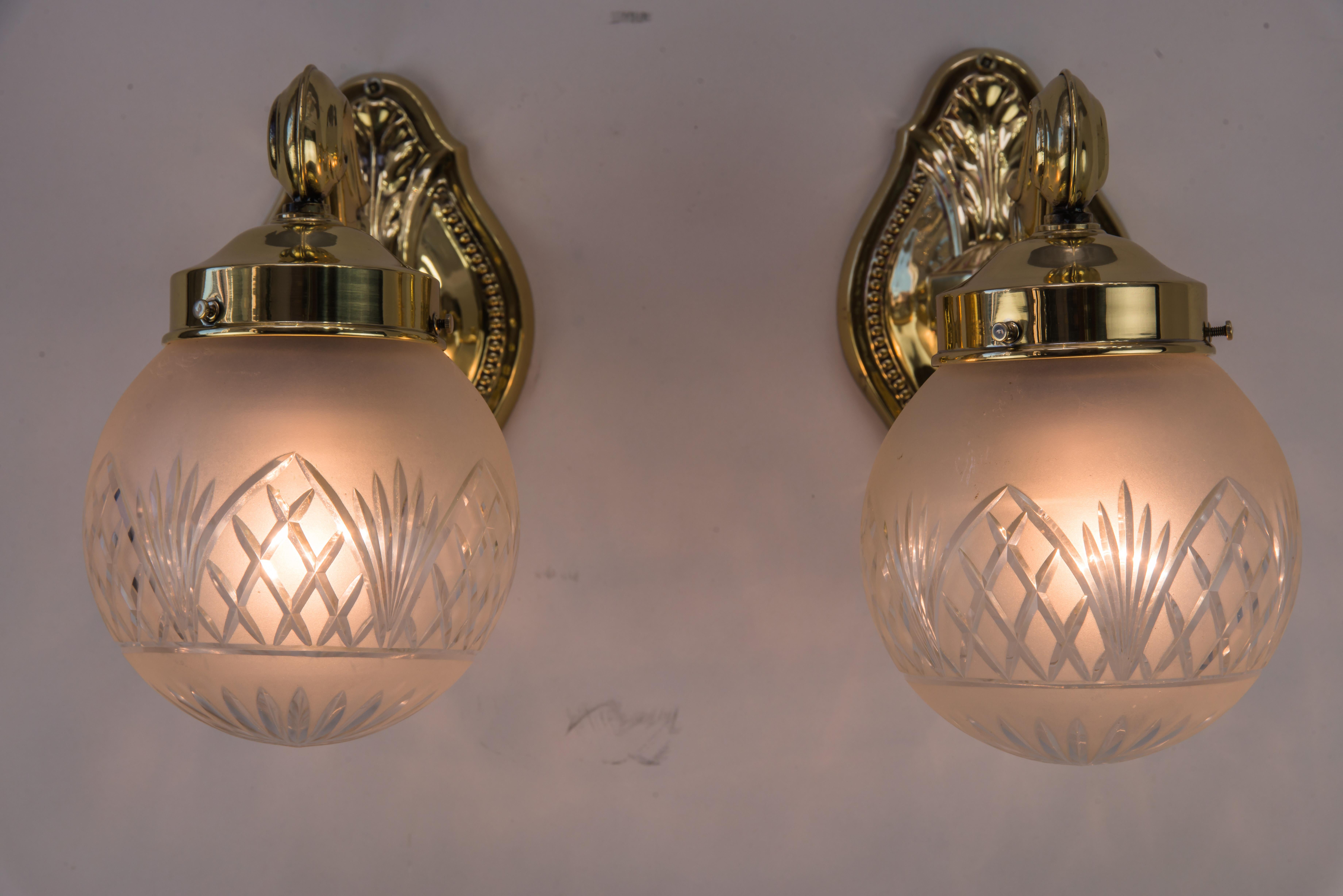Polished Two Historistic Wall sconces around 1890s with original cut glass shades