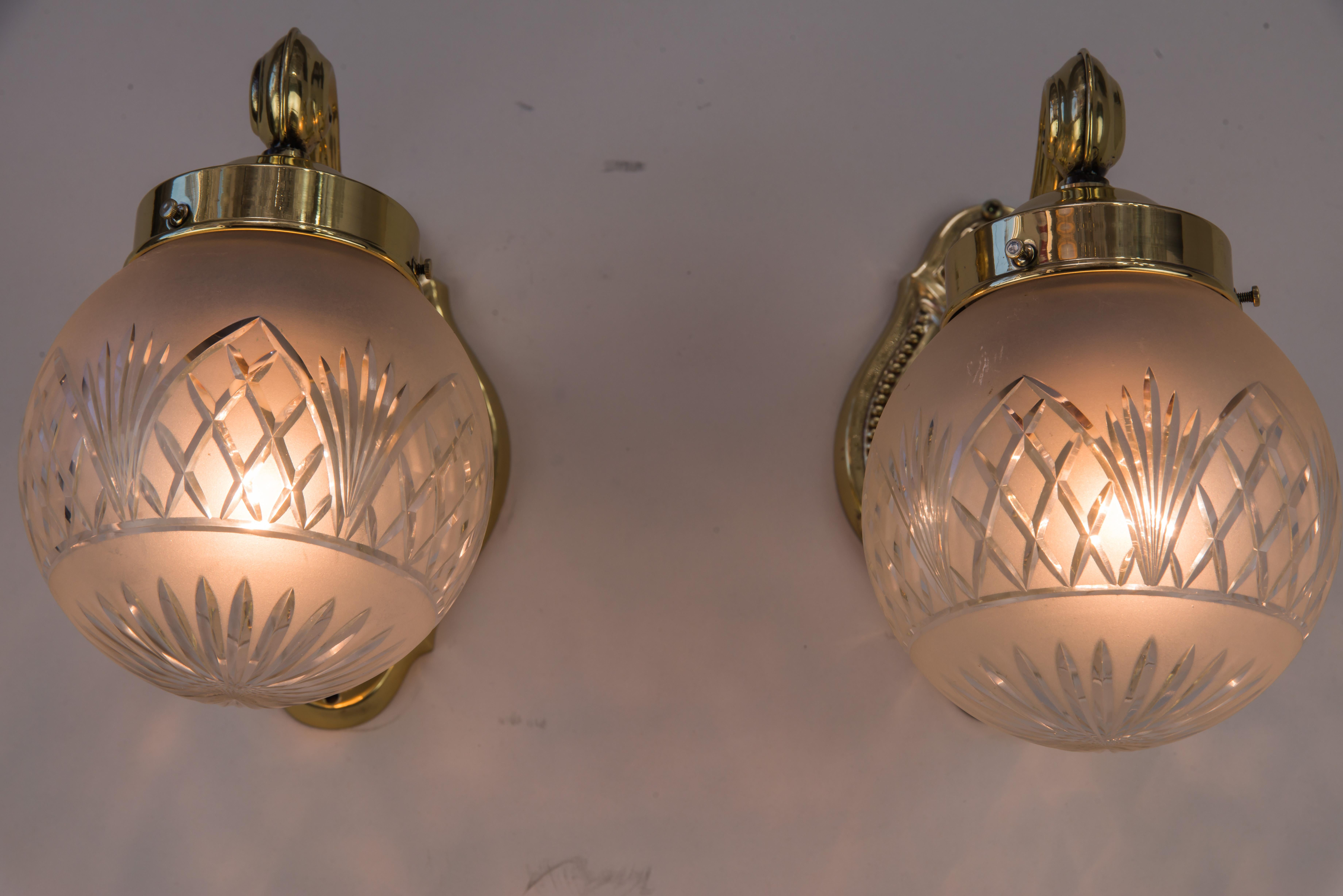 Brass Two Historistic Wall sconces around 1890s with original cut glass shades