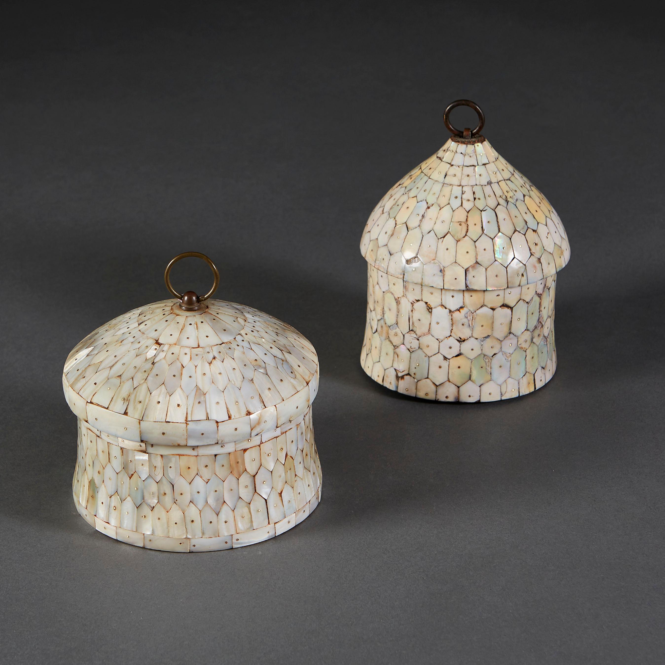 Two unusual domed boxes in late seventeenth century style, each inlaid in mother of pearl throughout, with bronze loop handle to the lid.

Please note: Boxes are of varying size. See dimensions below:

Height 17.00cm
Diameter 13.00cm

Height