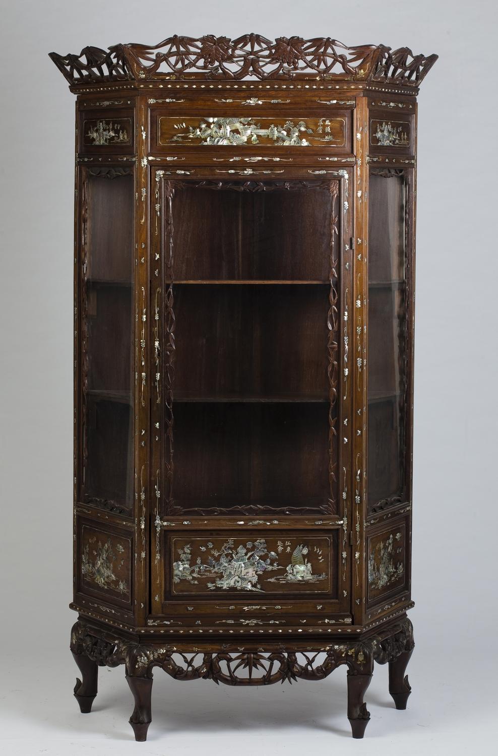 Two gorgeous vitrines in carved wood, with numerous incrustations of mother of pearl engraved and re-ornamented.
The design of the central panels of each showcase are different from the other.

Depth and width are given without cornices.
    