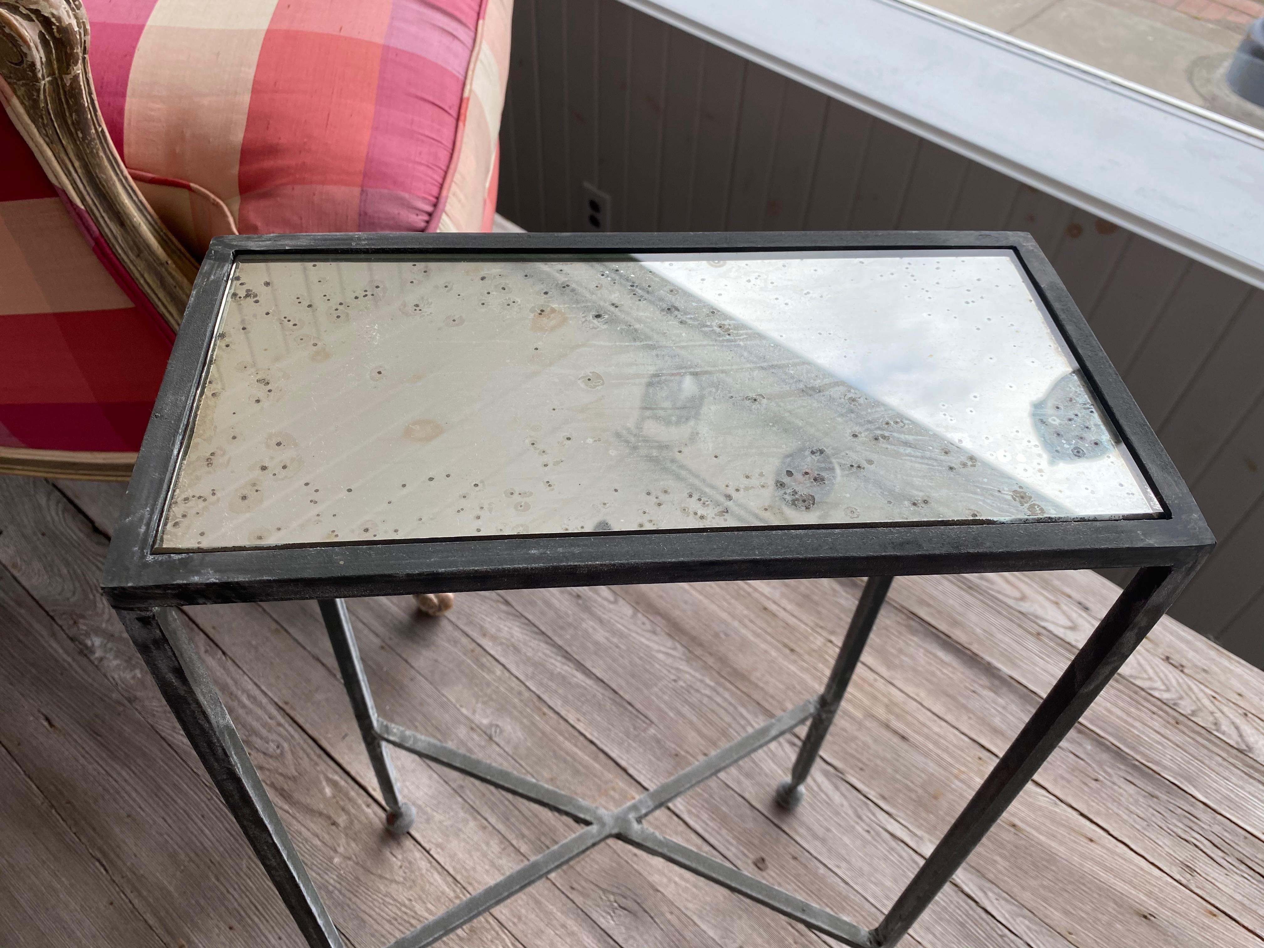 Two iron and antiqued mirror drinks table in the style of Maison Baguès.  Priced Per Table.