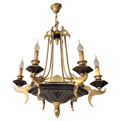 Dos candelabros italianos de latón y porcelana, hacia 1970-1980