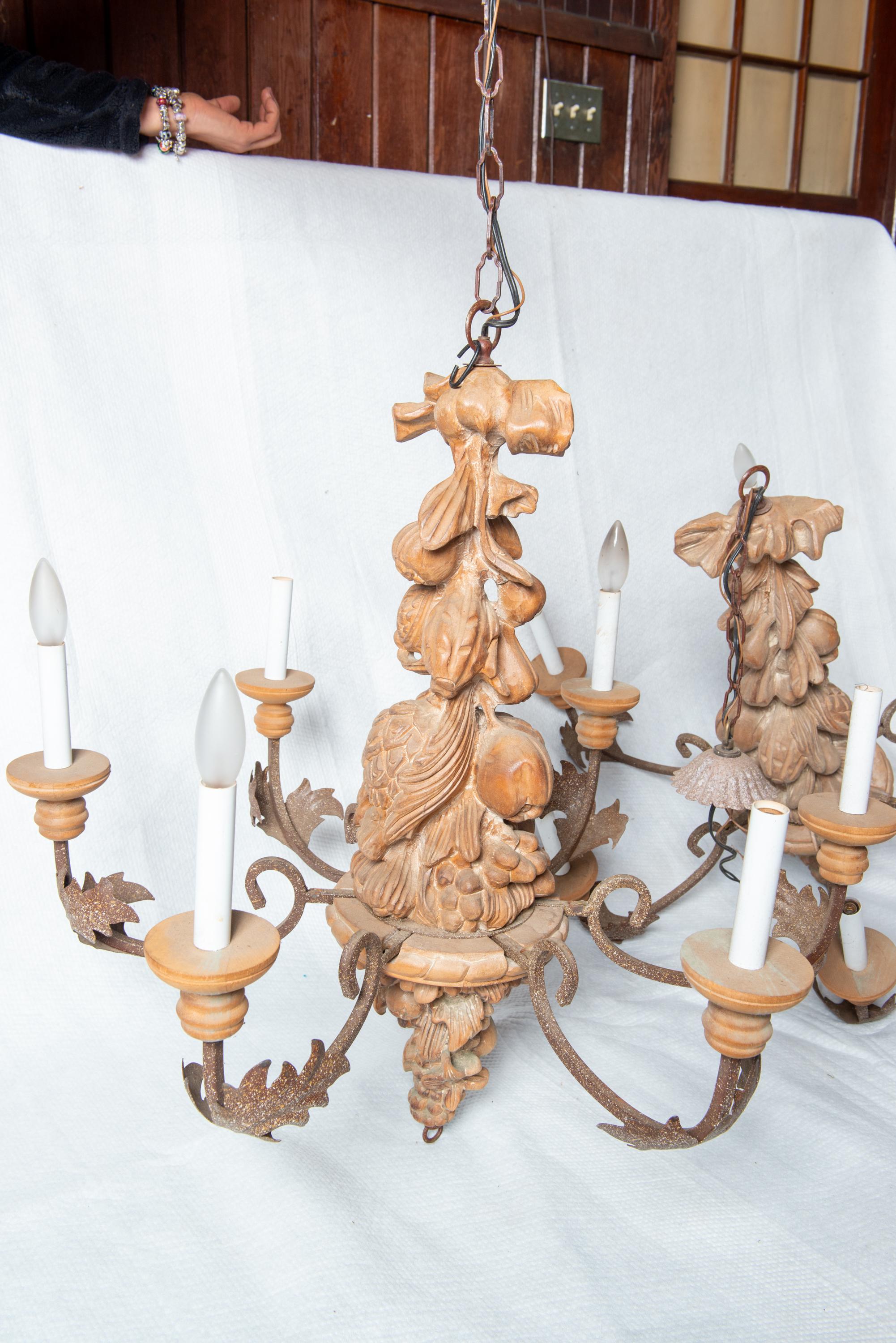 Late 20th Century Two Italian Carved Wood and Wrought Iron Chandeliers For Sale