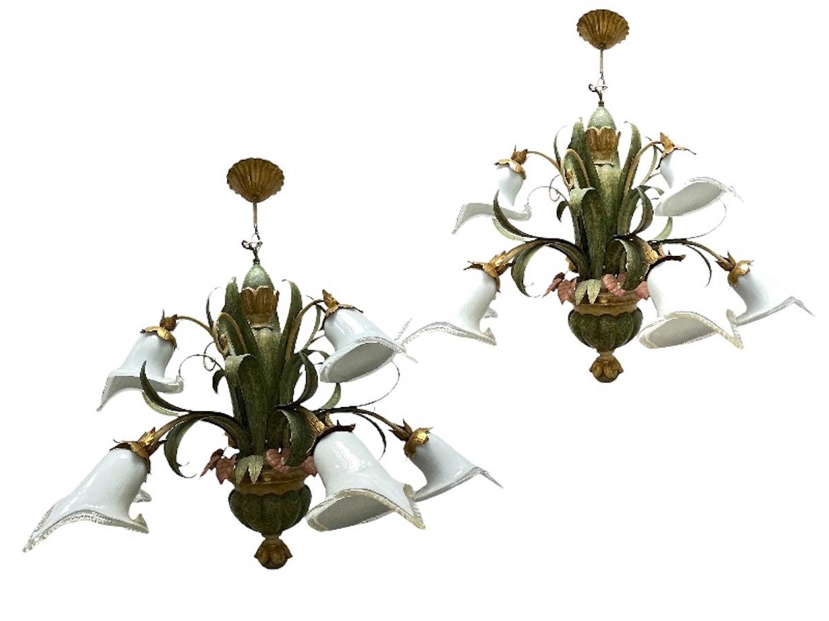 A set of two beautiful two-tier chandelier with nine lights that was made in Austria by Eglo Leuchten, circa 1980s.
The chandeliers are made in polychrome hand carved wood and metal, with glass shades. The color combination of the chandelier is very
