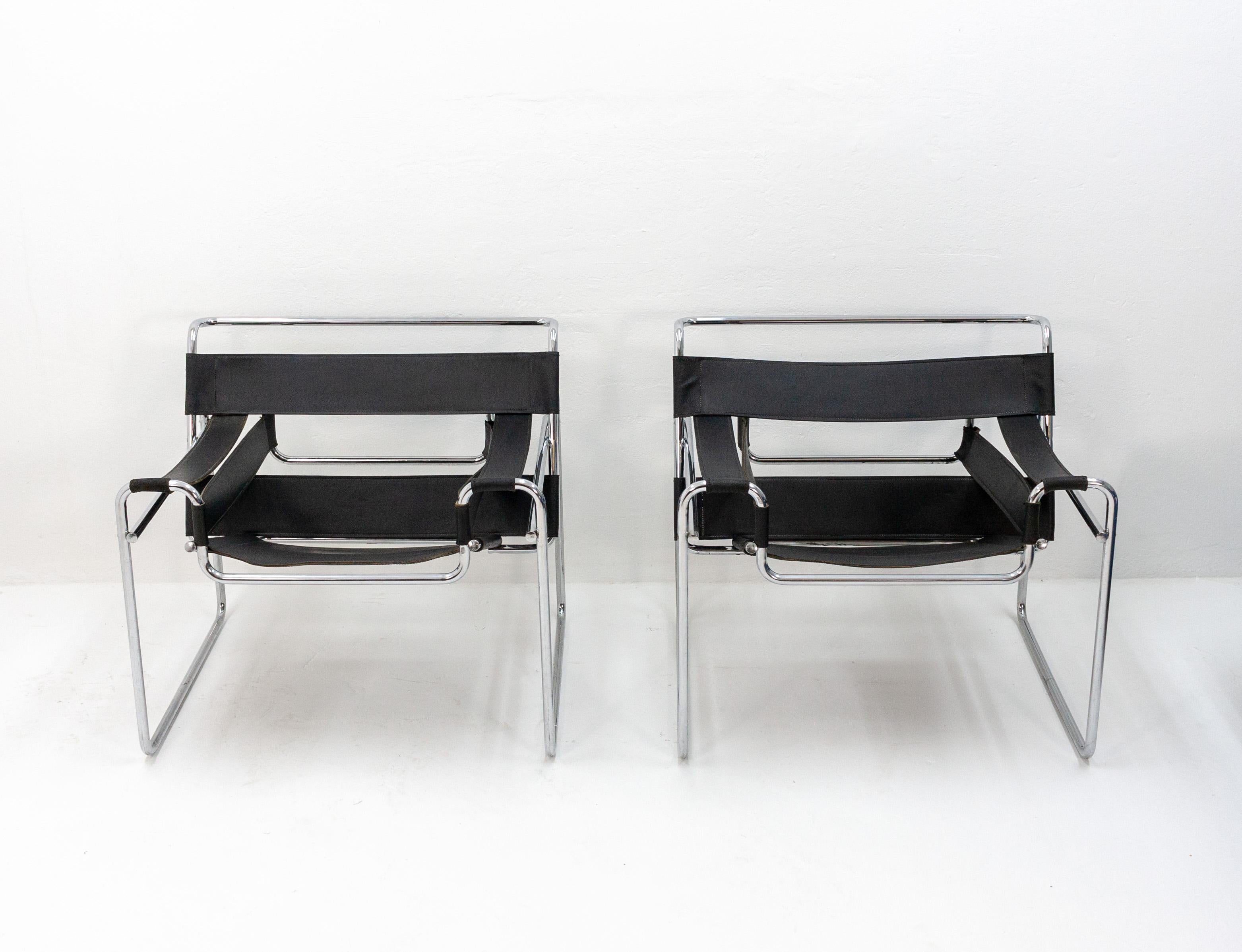 Quality pair of vintage Italian replicas of Marcel Breuer's tubular steel icon. Chromed steel frame with thick leather straps, 1970s.