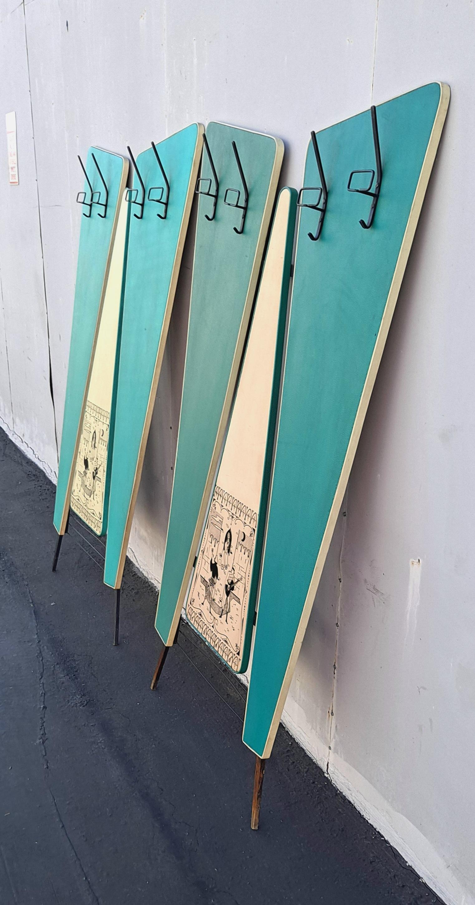 Pair of 1950s wall coat racks by Jeam-Verona. Formica in vinyl upholstery with the traditional painting of Verona. it can be sold as one for.
The wall coat rucks are different Italian midcentury color but other than that same dimensions .