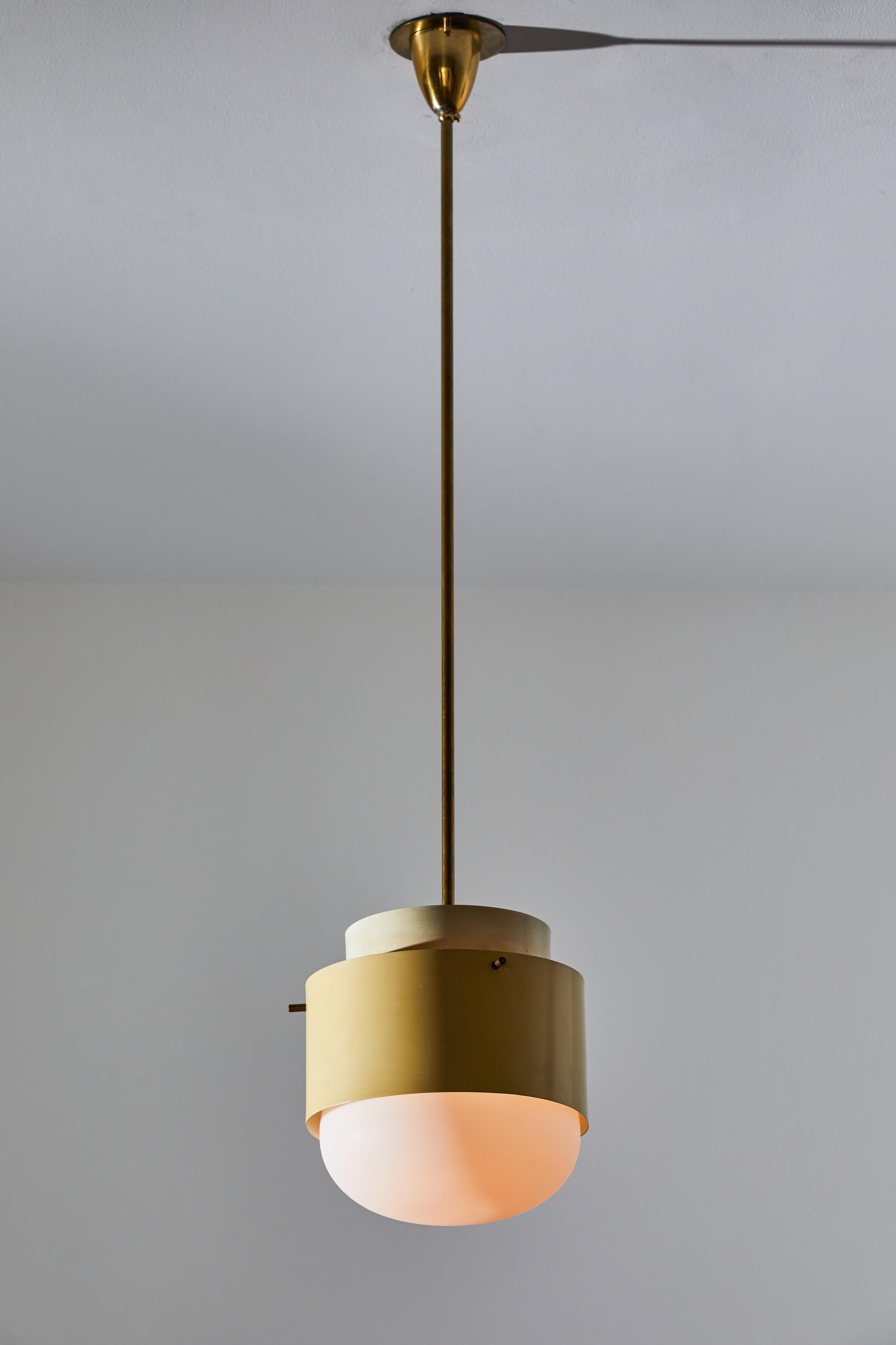 Single Pendant by Stilnovo, circa 1960s. Enameled metal, brushed satin glass diffusers, brass hardware. Rewired for U.S. junction boxes. Original canopy with custom brass ceiling plate. Light takes one E27 100w maximum bulb. QTY: 1 AVAILABLE