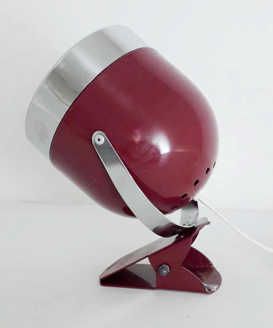 Vintage Italian adjustable spotlight with glossy purple enameled body and chrome hardware, mounted with simple clip base, can be used as wall light or table lamp, made in Italy circa 1970s
1 light / E14 type / max 40W
Measures: Height 7 inches,