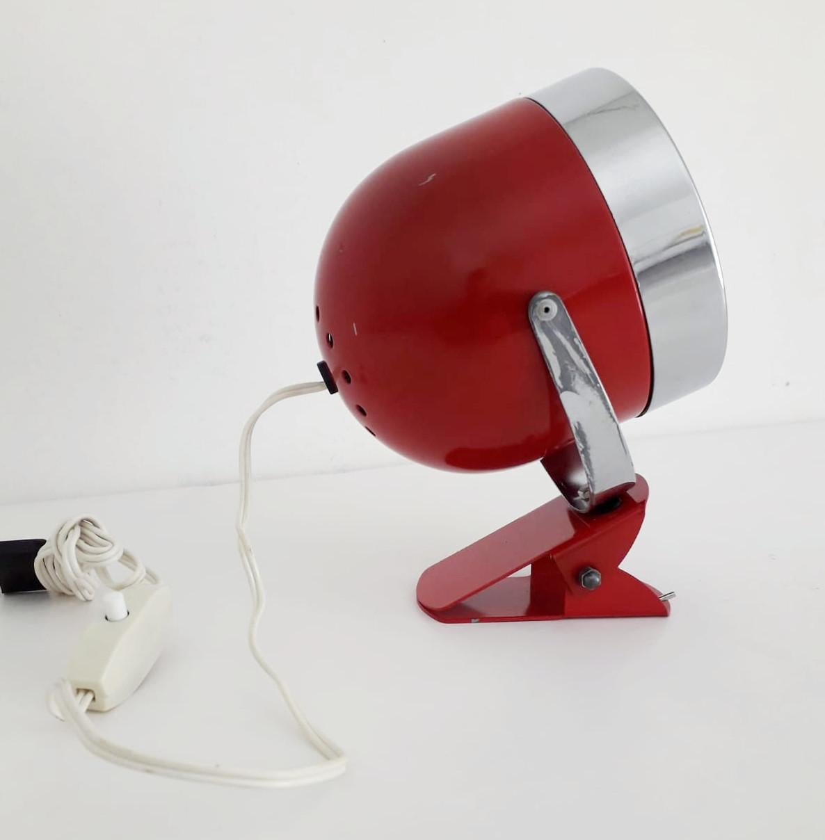Vintage Italian adjustable spotlight with glossy red enameled body and chrome hardware, mounted with simple clip base, can be used as wall light or table lamp / Made in Italy circa 1970s
1 light / E14 type / max 40W
Measures: Height 7 inches / width