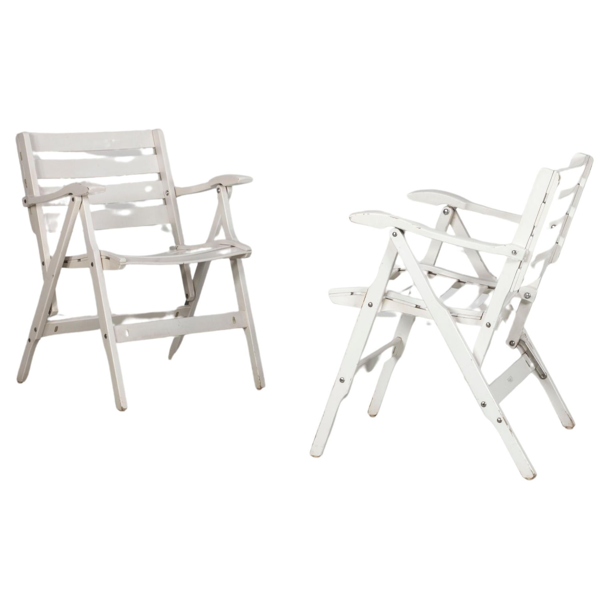 Two Italian white folding garden chairs, by Fratelli Reguitti from the 1950s