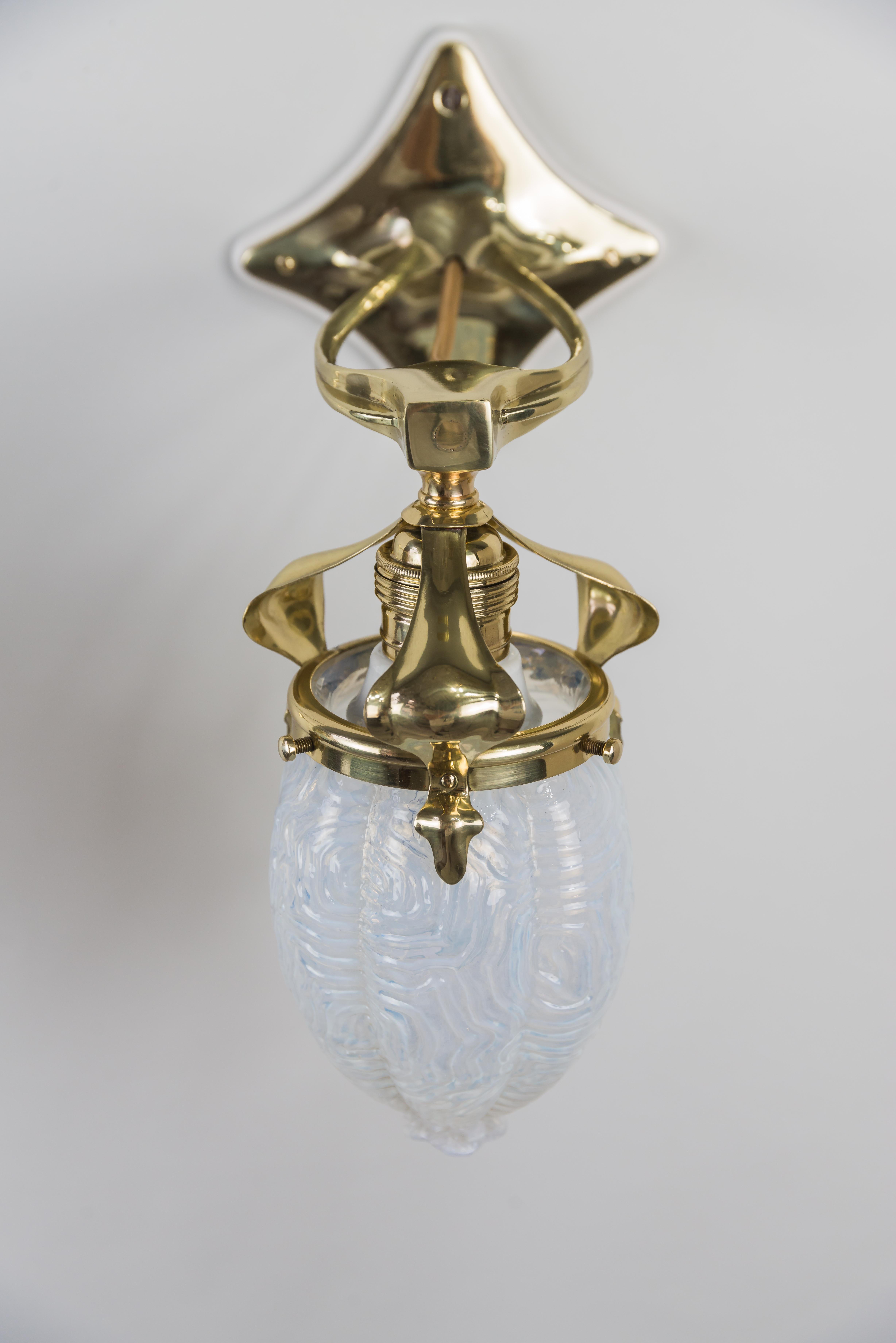 Brass Two Jugendstil Wall Lamps circa 1908 with Original Opaline Glass Shades