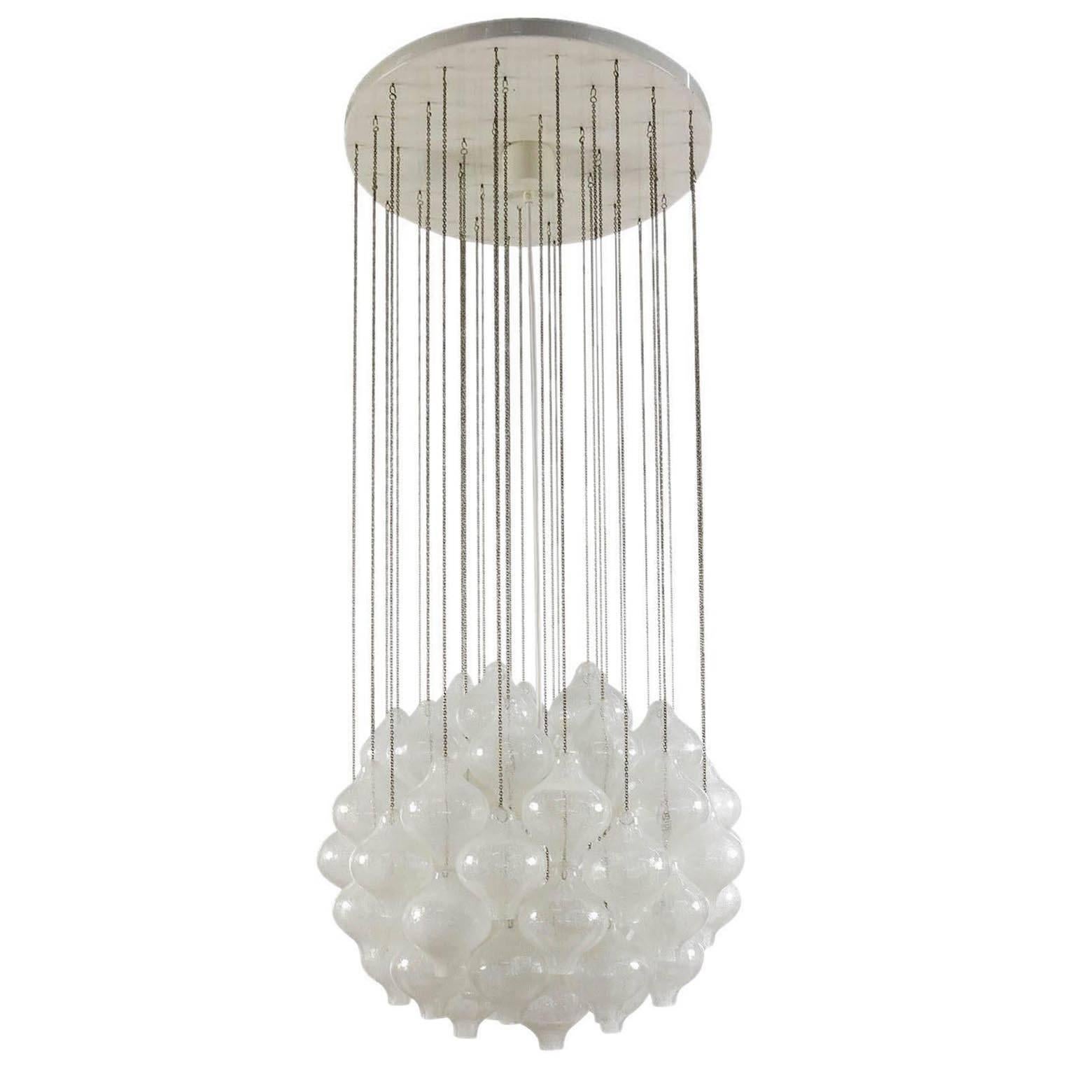 One of two rare 'Tulipan' glass pendant chandeliers by J.T. Kalmar, Austria, Vienna, manufactured in Midcentury, circa 1970 (late 1960s or early 1970s). The name Tulipan derives from the tulip shaped hand blown bubble glasses. Each glass is handmade