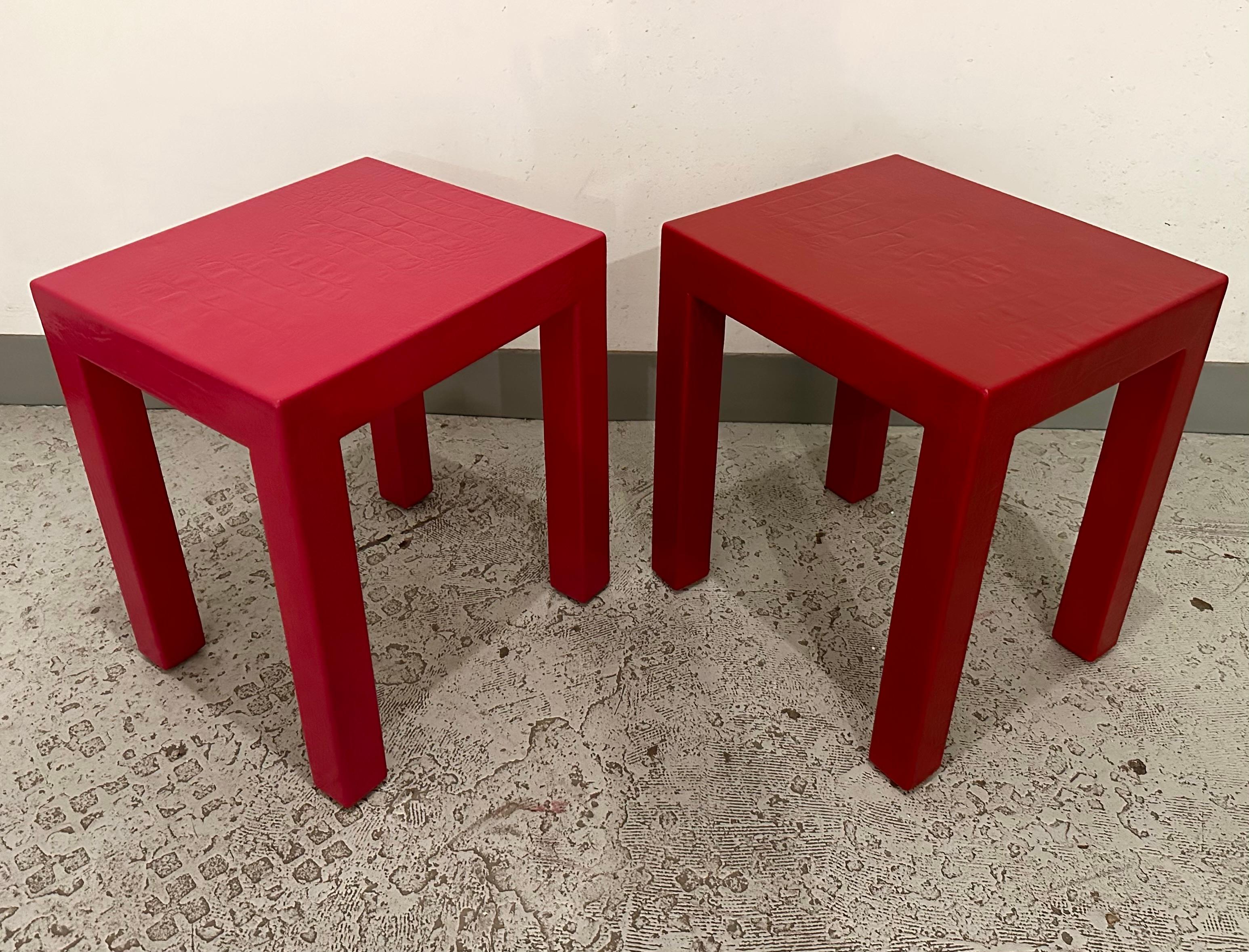 Uncommon early pair of Karl Springer's iconic crocodile printed leather Parsons side or occasional tables. Identical in size, one is clad in a fun hot fuchsia while the other is a more sombre burgundy. 

Part of a group of furnishing we acquired