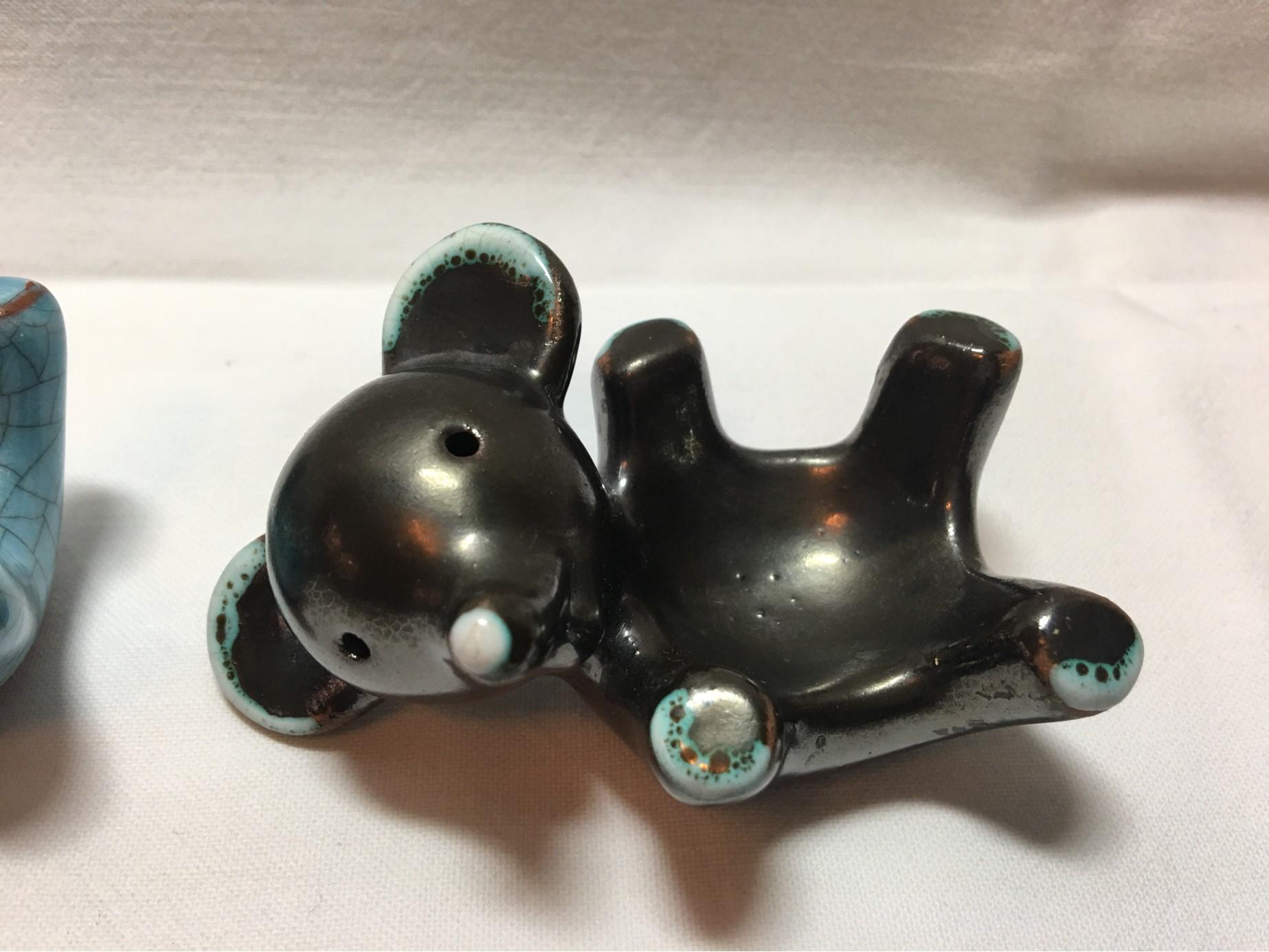 Two ceramic egg cups in the shape of cute little bears. Designed by Walter Bosse of Austria who was employed by Karlsruhe Majolika from 1953 onward. He contributed many designs to their collection most prominently in Animal forms with practical or