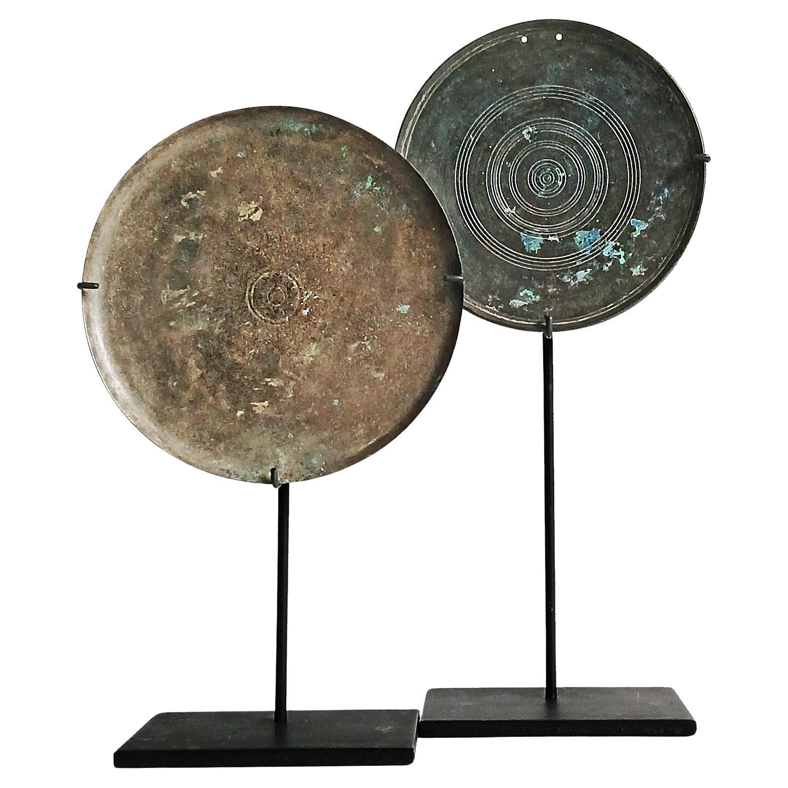 Two Khmer Bronze Mirrors, 13th - 15th Century