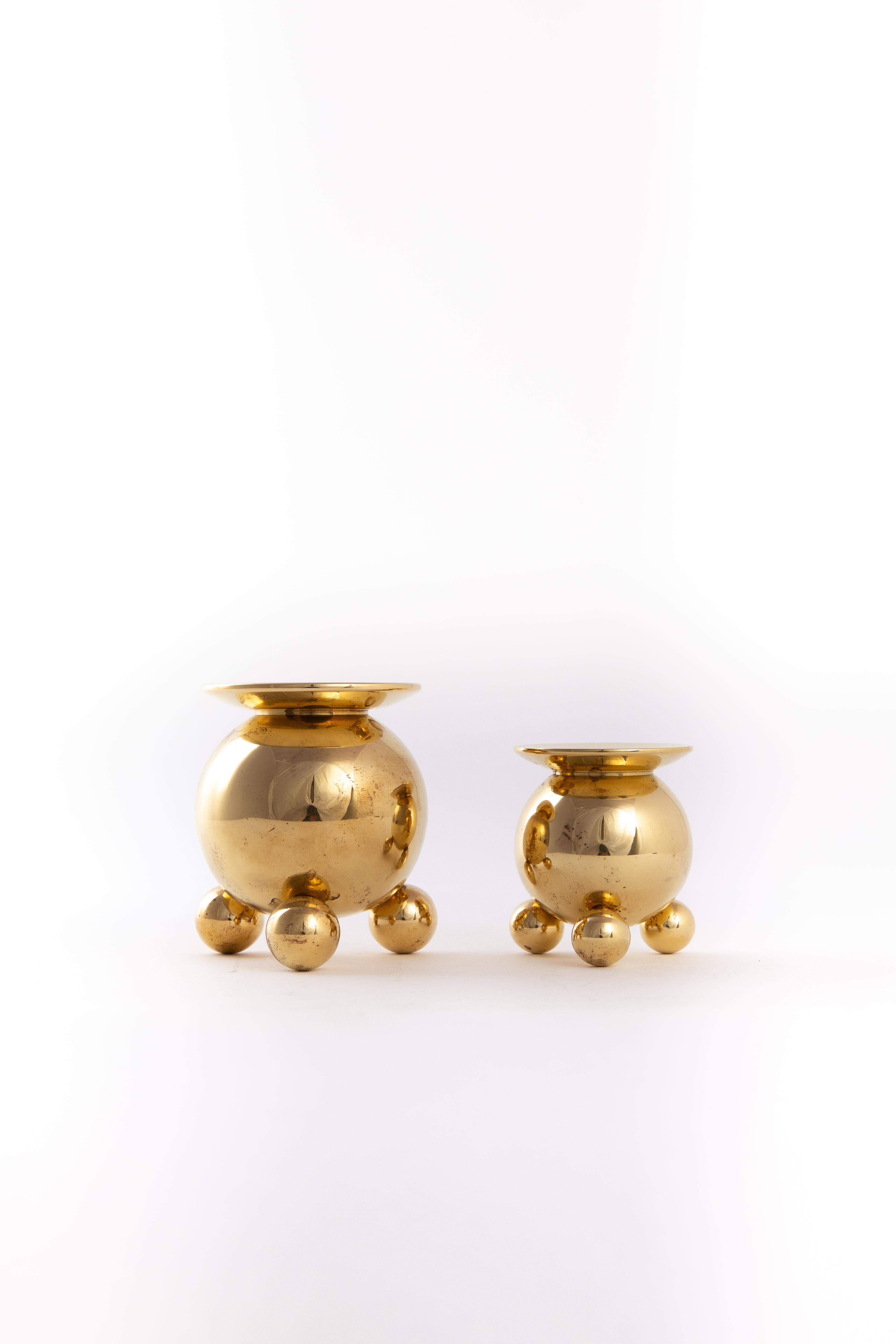 Two very heavy brass metal candleholders. Marked on the bottom. Size of the diameter for the candles is 20mm.
Two sizes:
Big candleholder diameter 7 cm and 7.5 cm high
Smaller candleholder diameter 5.4 cm and 6 cm high.
