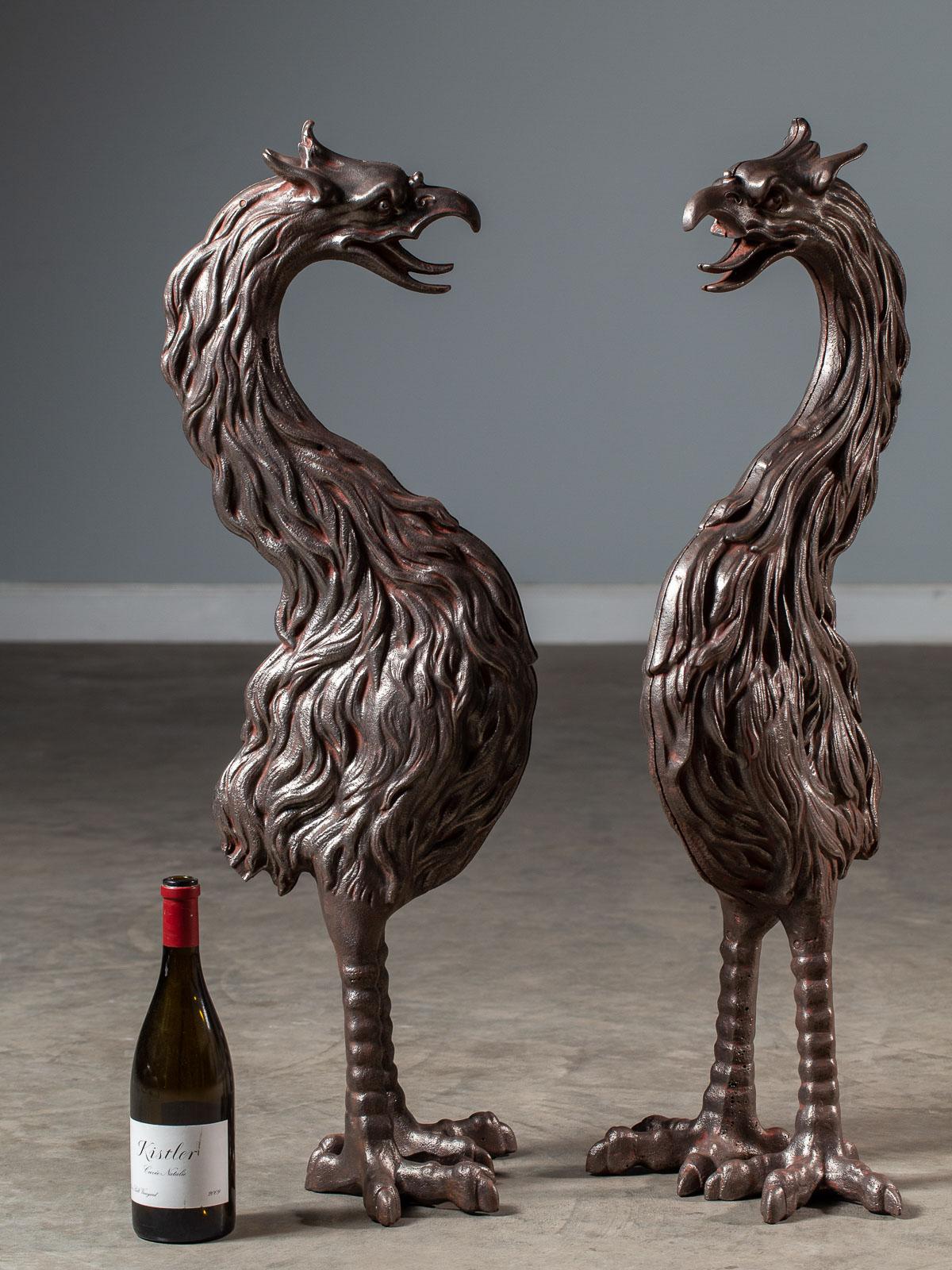 This pair of tall cast iron Phoenix birds are antique French circa 1880 and originally graced the entry to a lavish garden. The legend of the Phoenix bird appears in Greek mythology as associated with Sun and who rises from the ashes to live again.