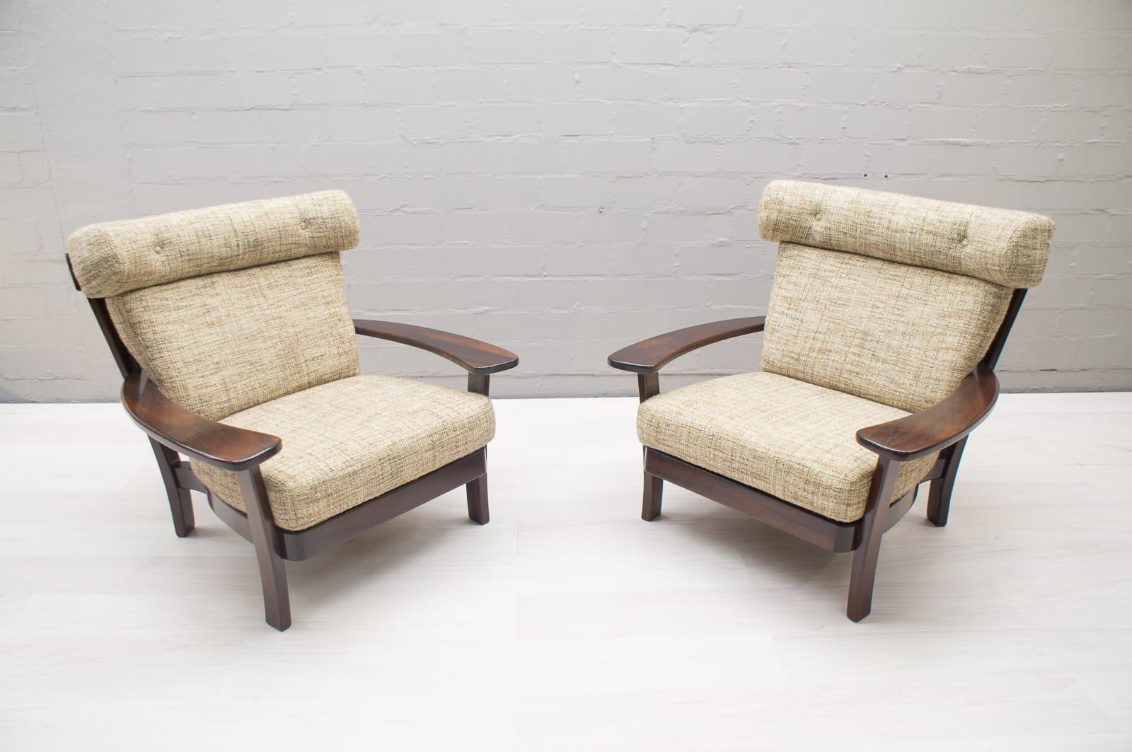 Armchairs, rosewood, Brazilian design, European execution, 1960s. The sofa set is still in the original upholstery fabric. Altogether a very good condition.

This settee is executed in Brazilian rosewood and velvet and holds several