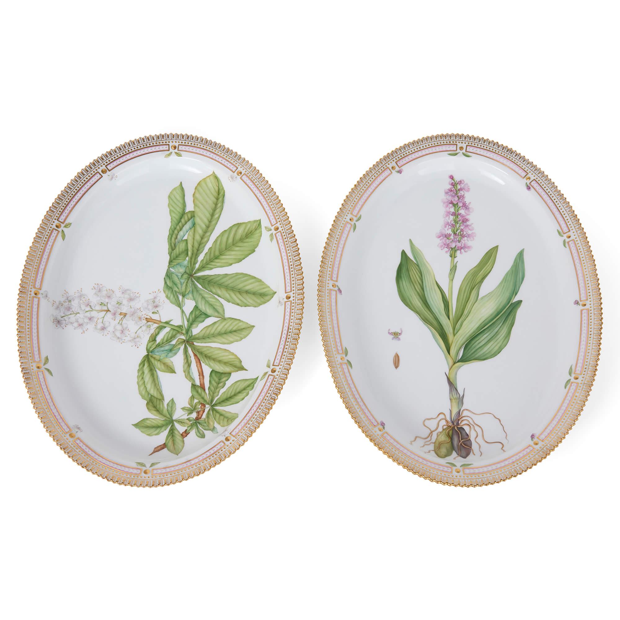 Two Large Flora Danica Danish Porcelain Royal Copenhagen Oval Platters 
Danish, 20th Century
Height 5cm, width 51cm, depth 37cm

These exceptional oval platters are part of the celebrated Flora Danica porcelain series, produced by the prestigious