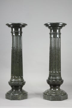 Two large fluted green marble columns
