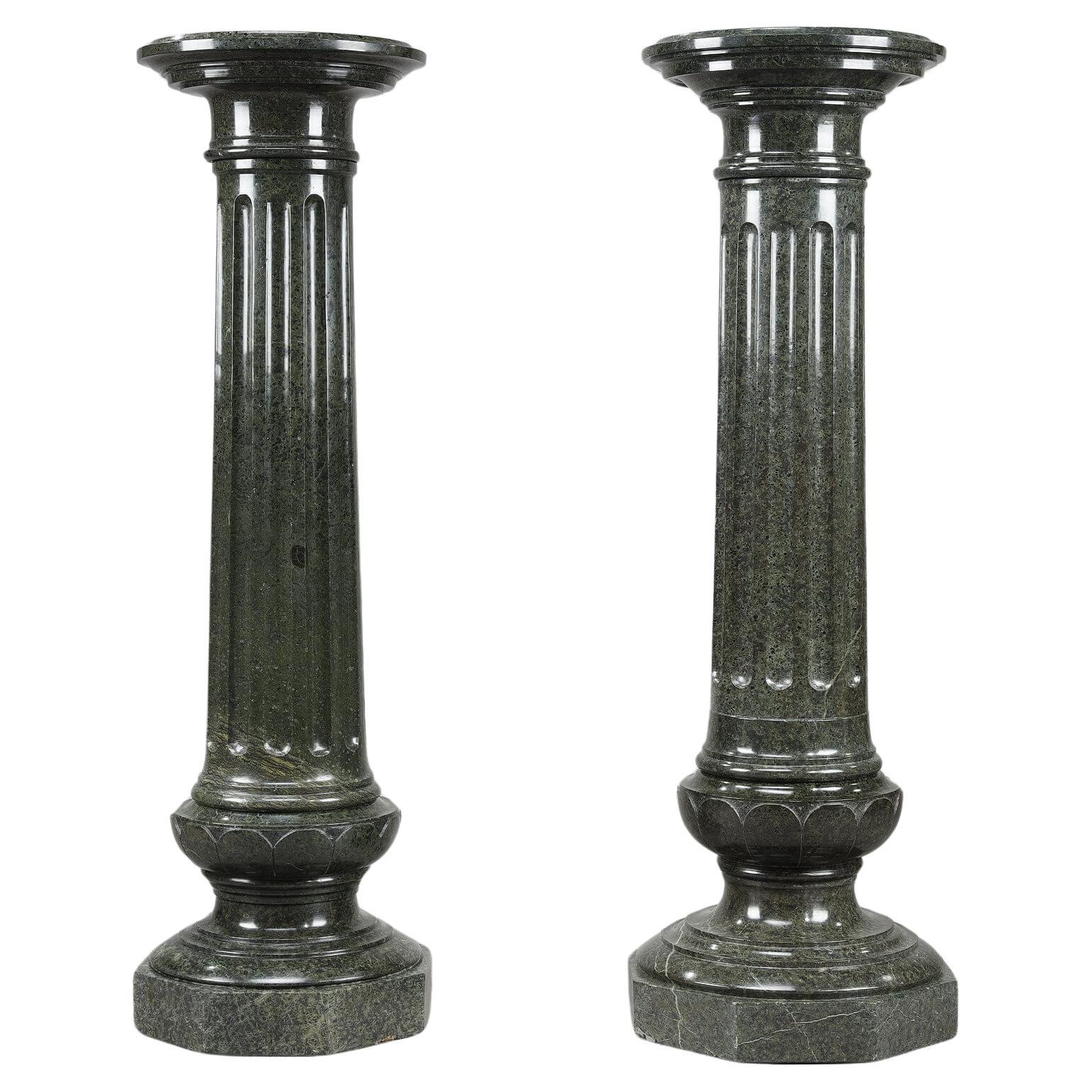 Two large fluted green marble columns For Sale