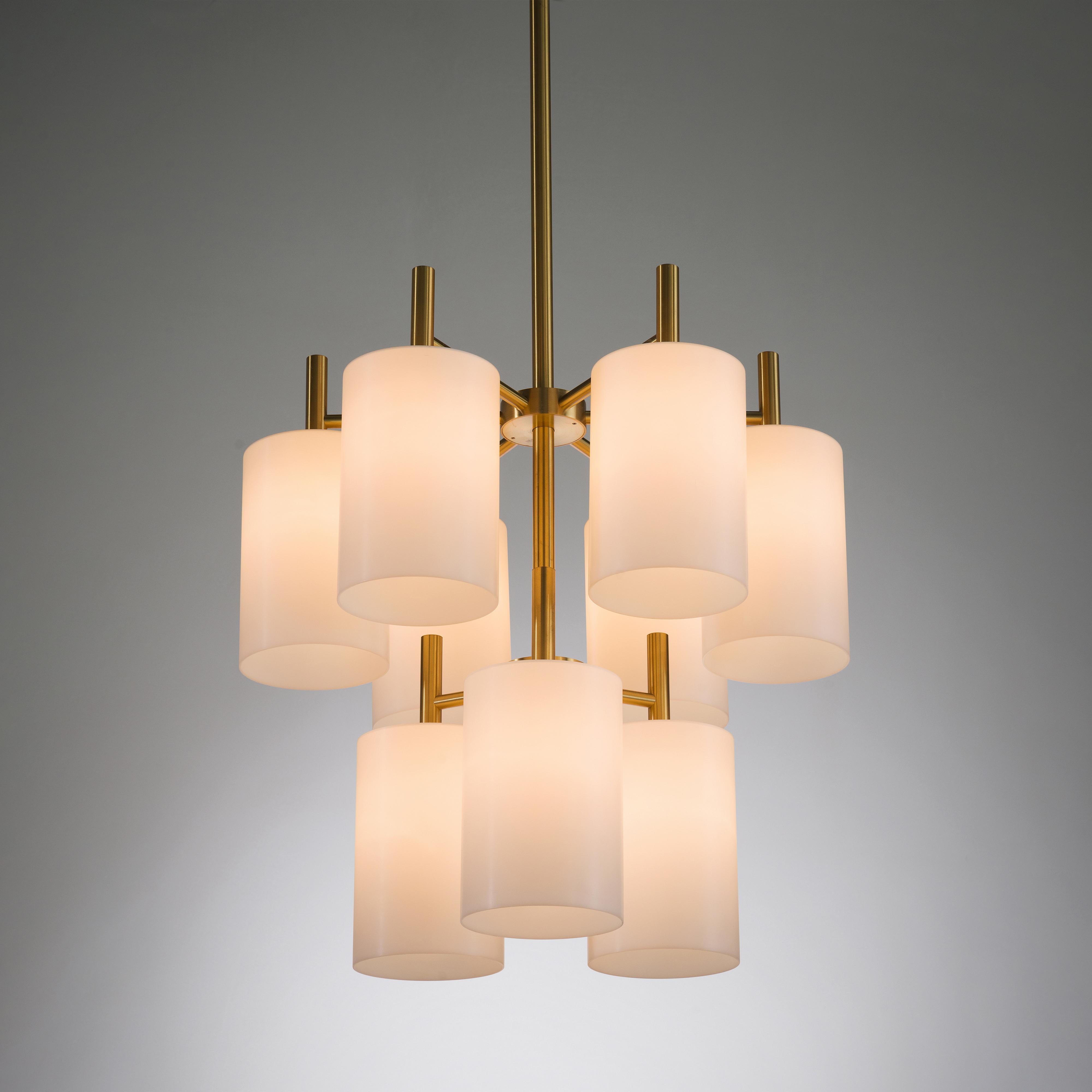 Luxus of Sweden chandeliers, brass, lucite, Sweden, 1960s

These elegant chandeliers are made by the manufacturer Luxus of Sweden. The base of these lovely chandeliers is executed in a warm brass. The tall stems with nine branches all end with a