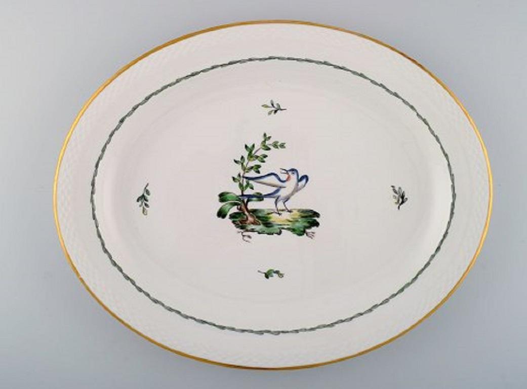 Two large oval Royal Copenhagen serving dishes in hand painted porcelain with bird motifs and gold decoration, early 20th century.
Measures: 41.5 x 33.5 cm.
In very good condition.
Stamped.
2nd factory quality.