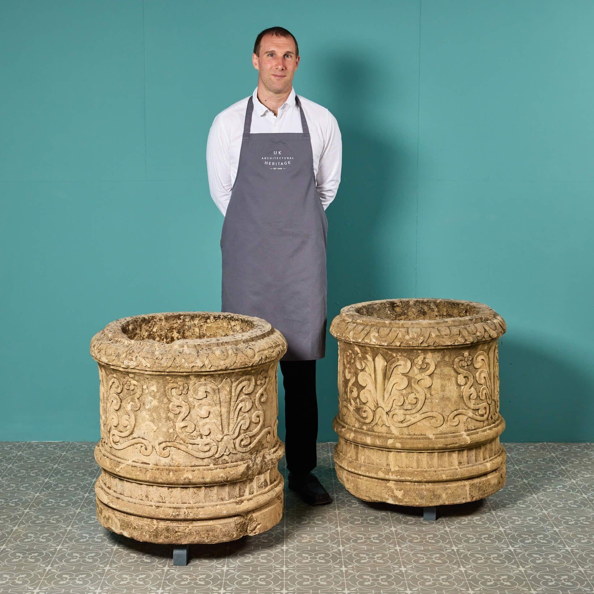 A rare pair of impressive large scale reclaimed carved limestone planters detailed with Regency style anthemion motifs and scrolls.

With a Mediterranean look, these magnificent planters will sit in pride of place in any garden, the limestone a soft