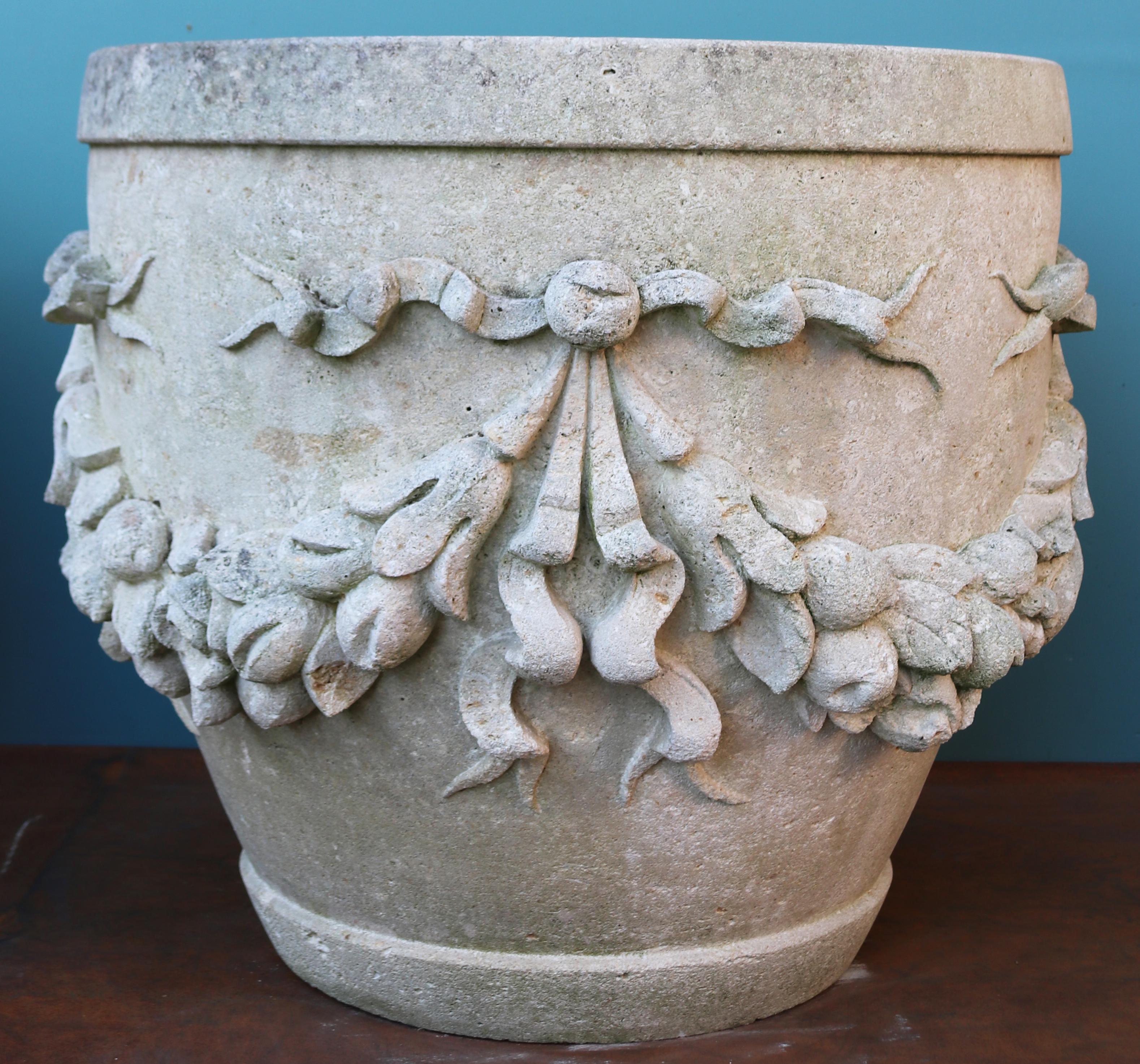 A pair of large hand carved English limestone planters of classical design, featuring garland and ribbon decoration.

Additional dimensions:

Internal diameter 54.5 cm

 

Condition report

Good structural condition. Weathered