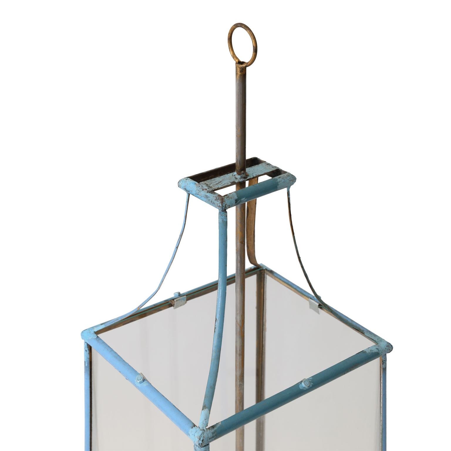 Large rectangular tole lantern, simple, elegant tole and wrought iron lantern. Painted in light blue accented by a gilded chrome central rod.